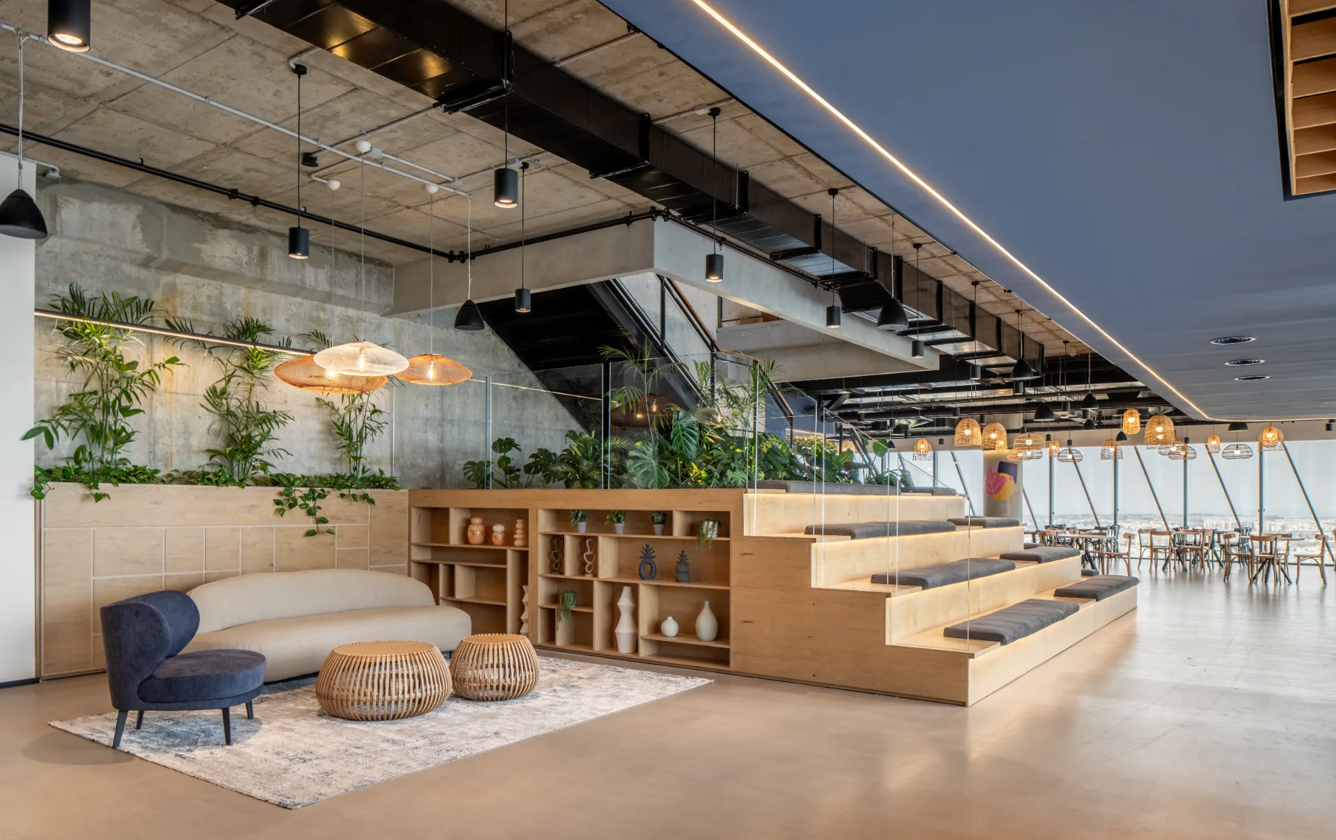 Stepped lounge with planting and woven pendants