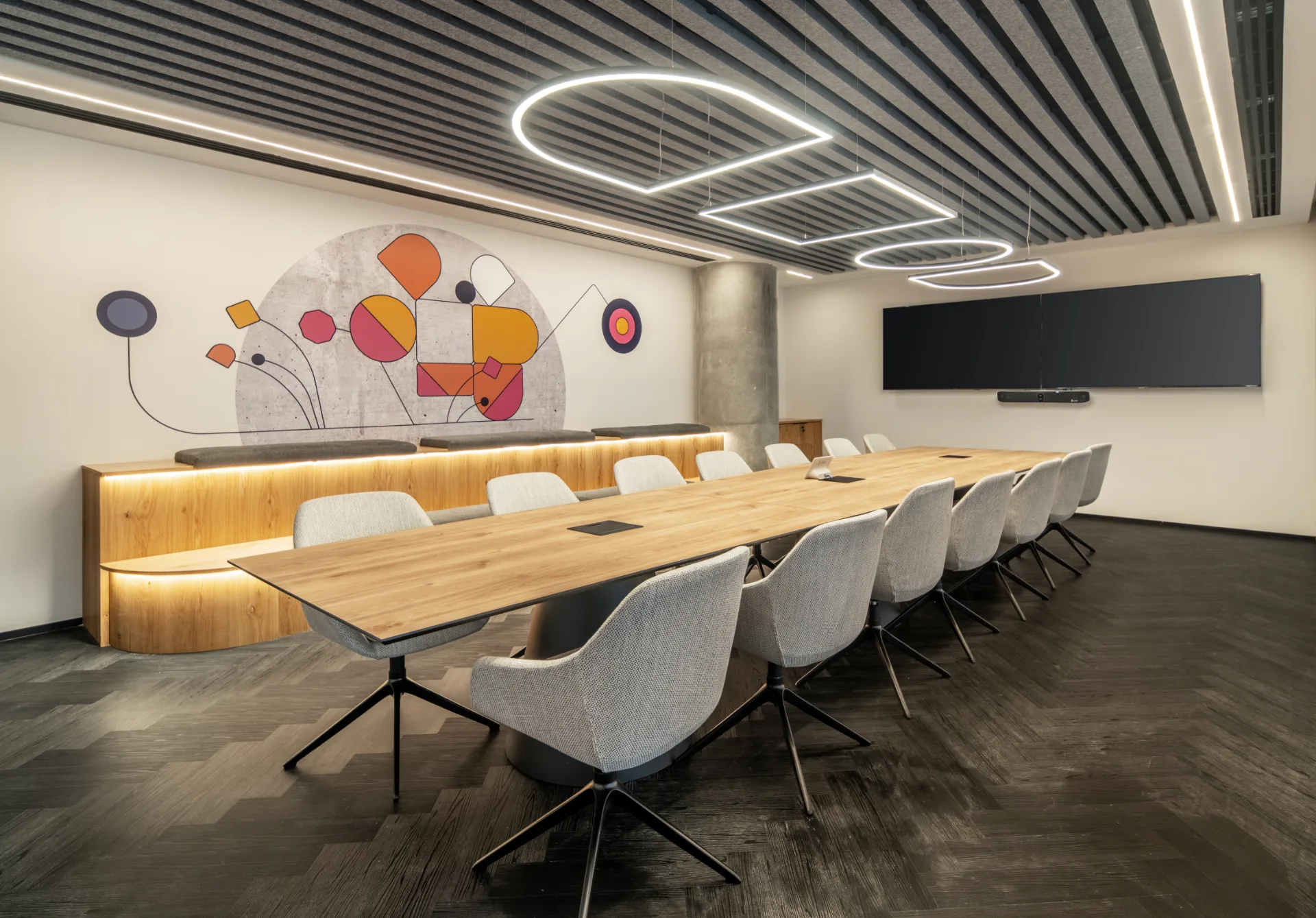 Boardroom with curved linear ceiling lighting