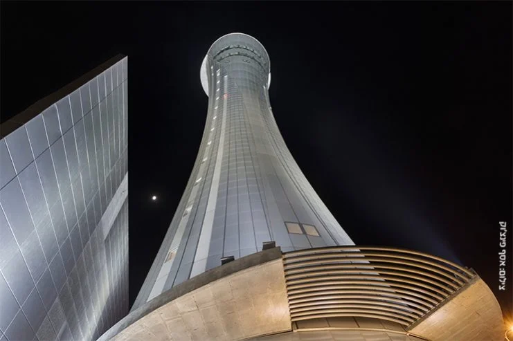 Looking up at the illuminated control tower