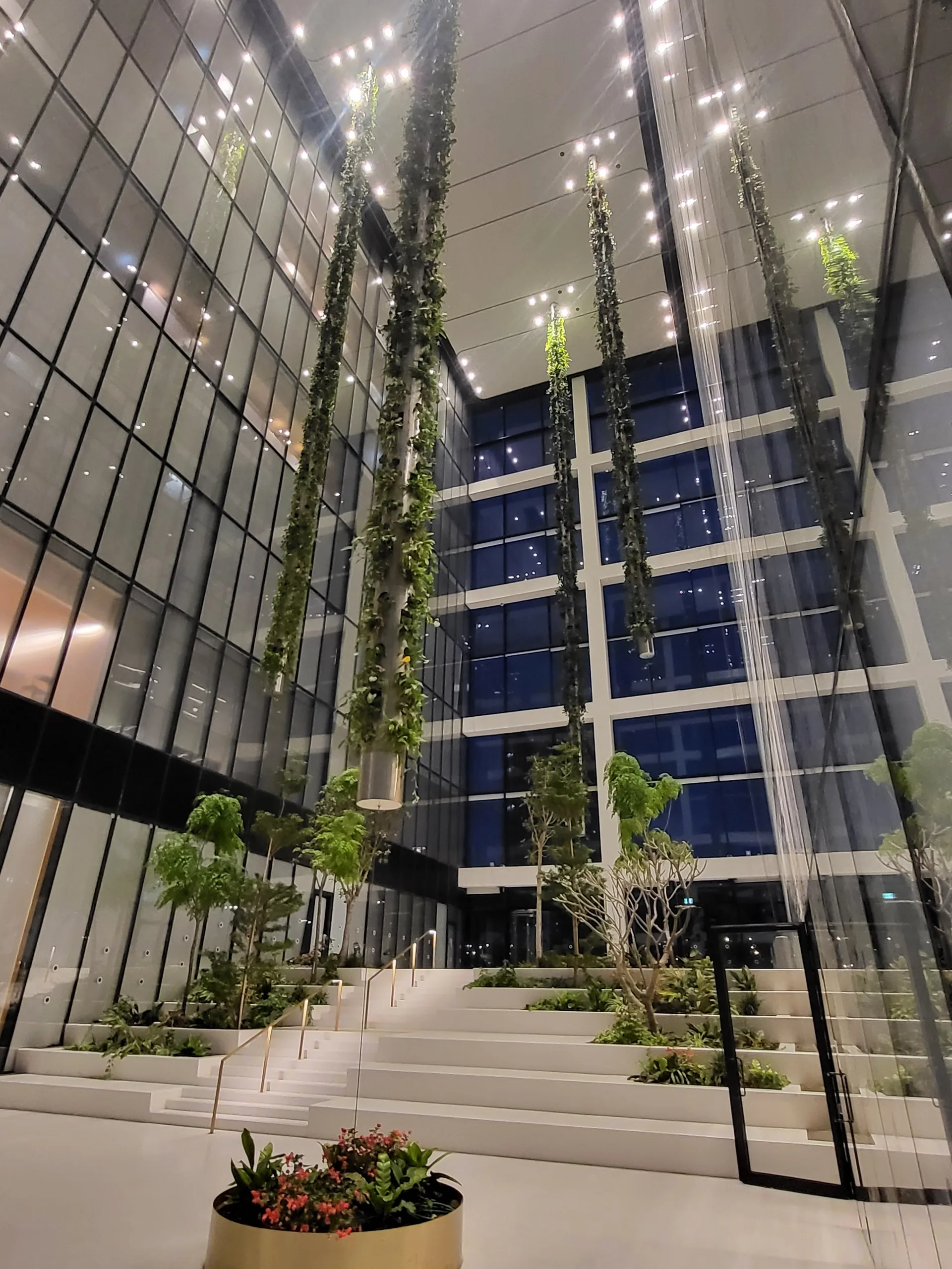 The double-height atrium with hanging vertical gardens