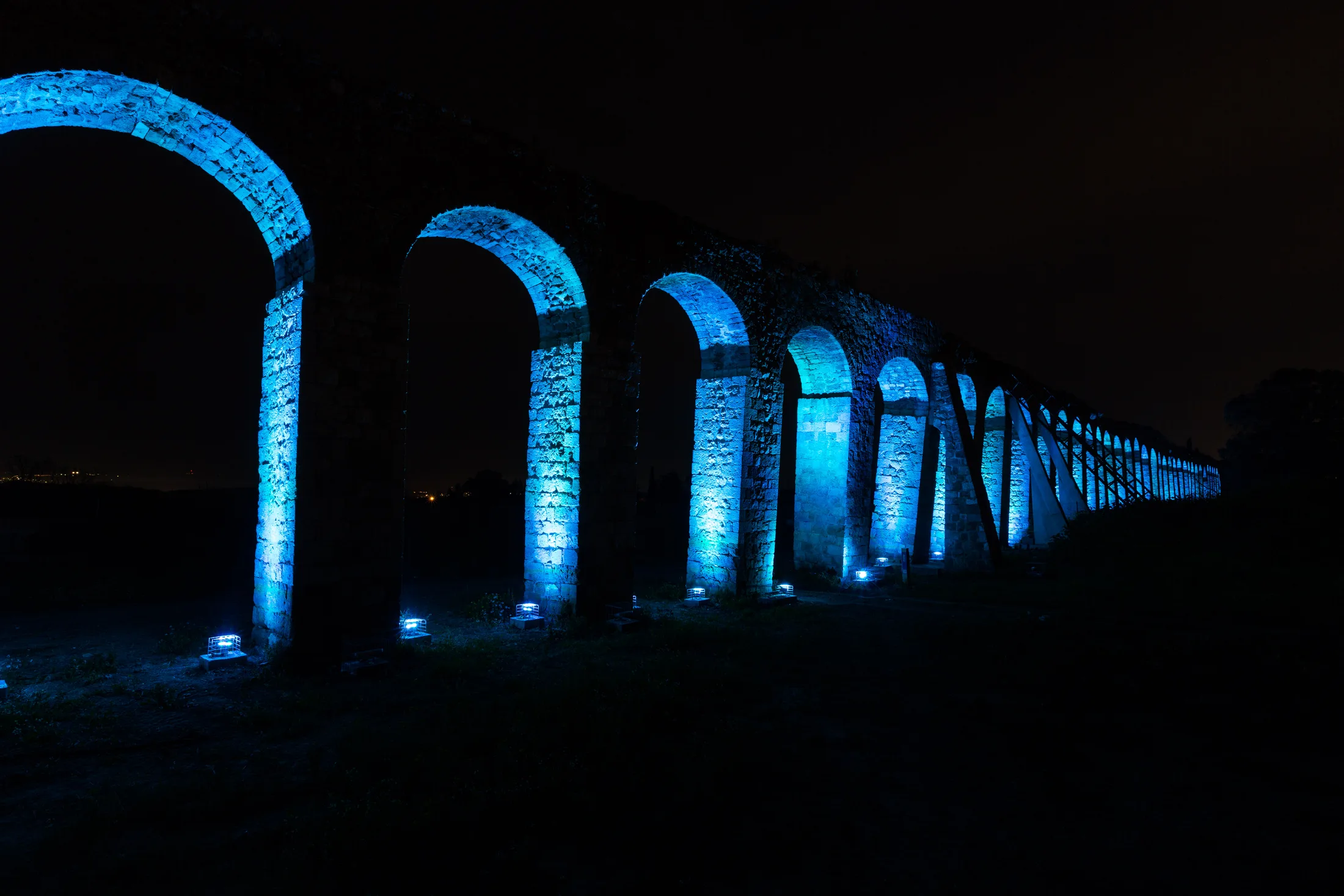 Aqueduct illuminated in blue