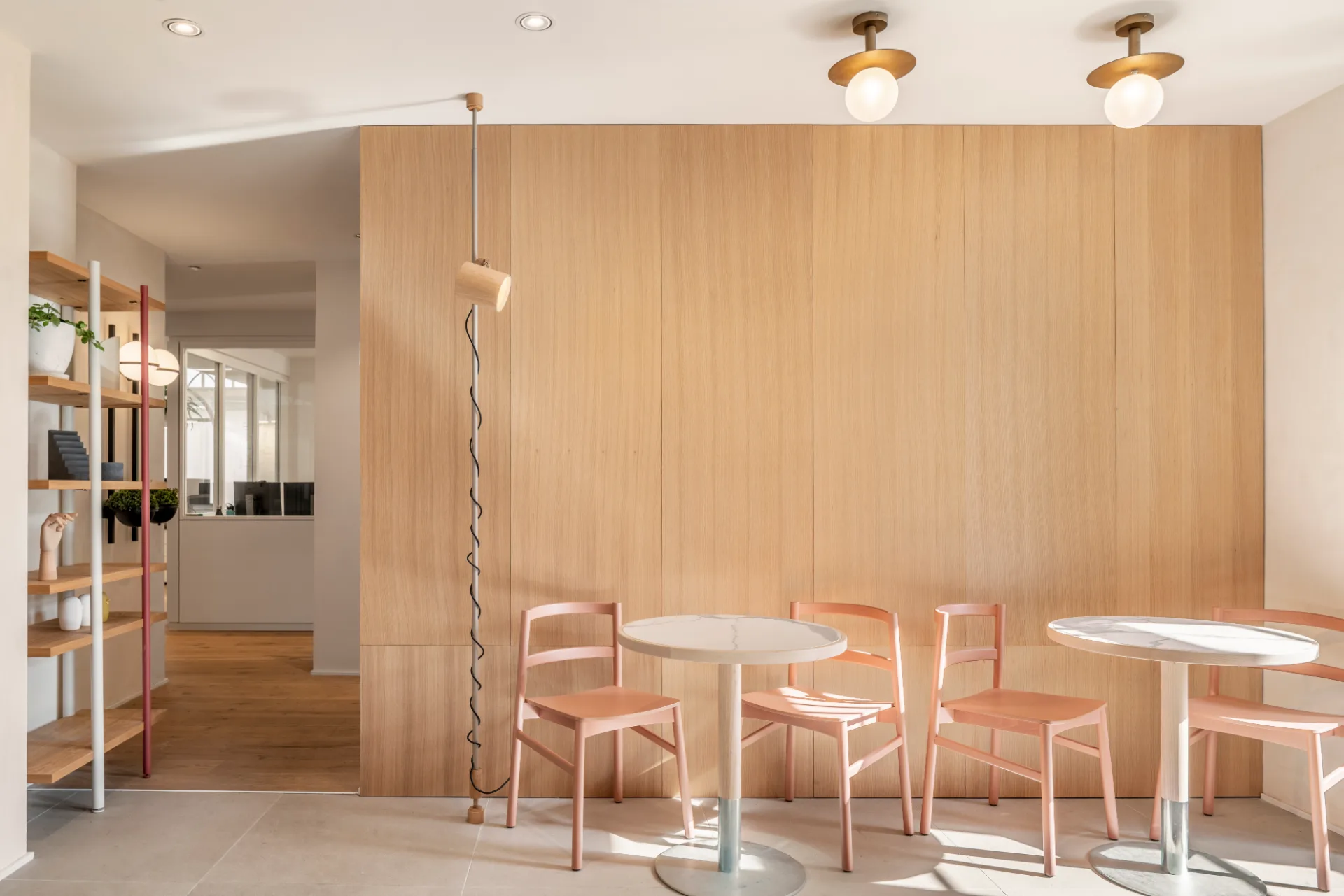 Cafe corner with timber panelling and light furniture