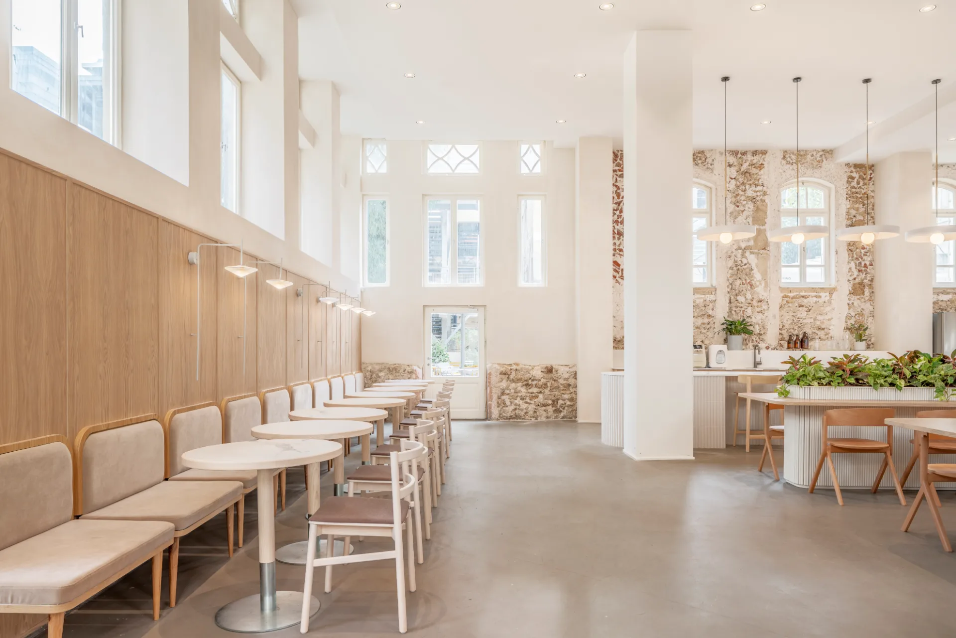 Banquette seating along arched windows