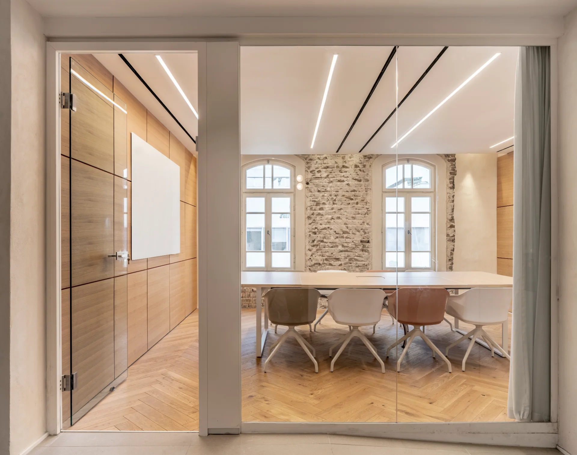 White meeting room with linear lighting