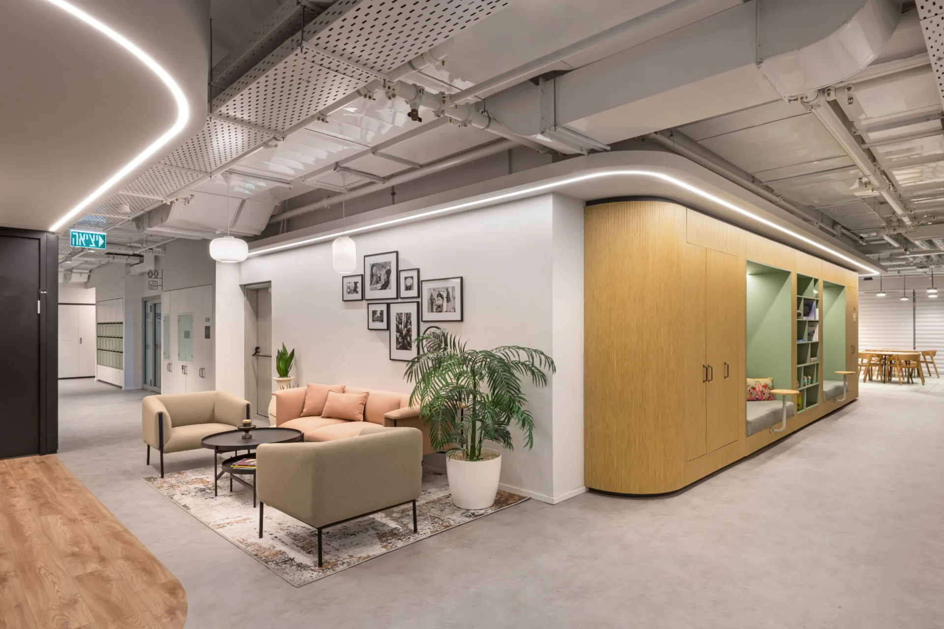 Lounge beside a curved timber pod lit by a light line