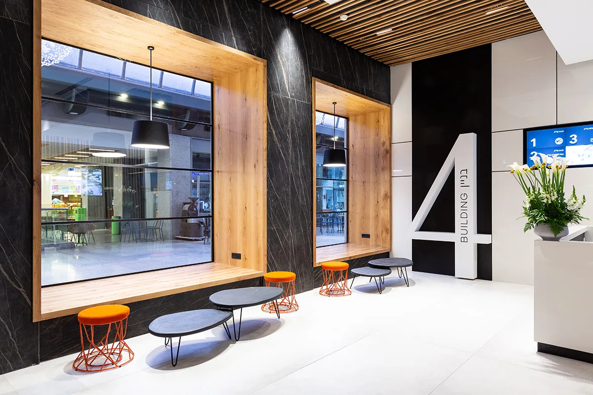 Building 4 signage and timber-framed windows in the lobby