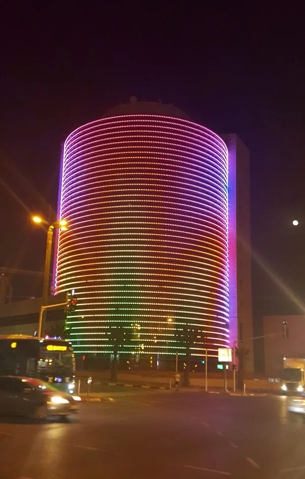 The full-color LED facade running a rainbow gradient