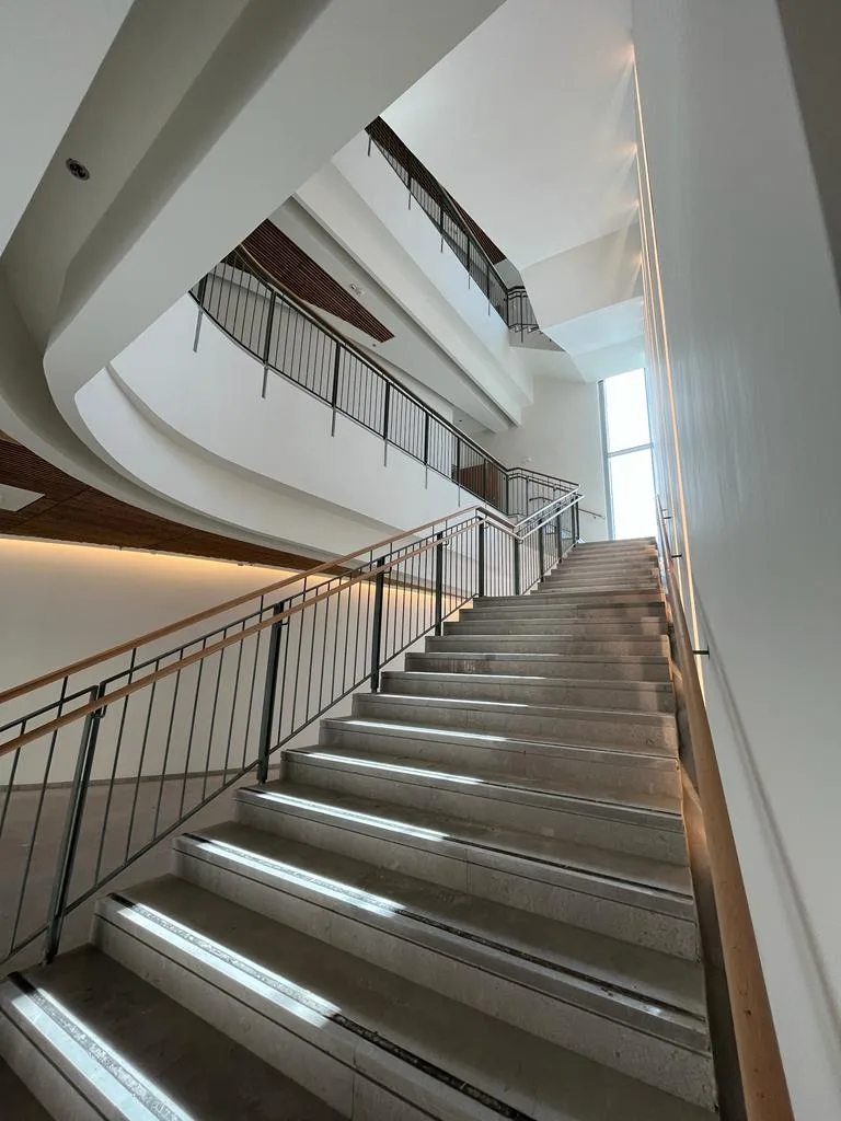 Staircase with an illuminated handrail line