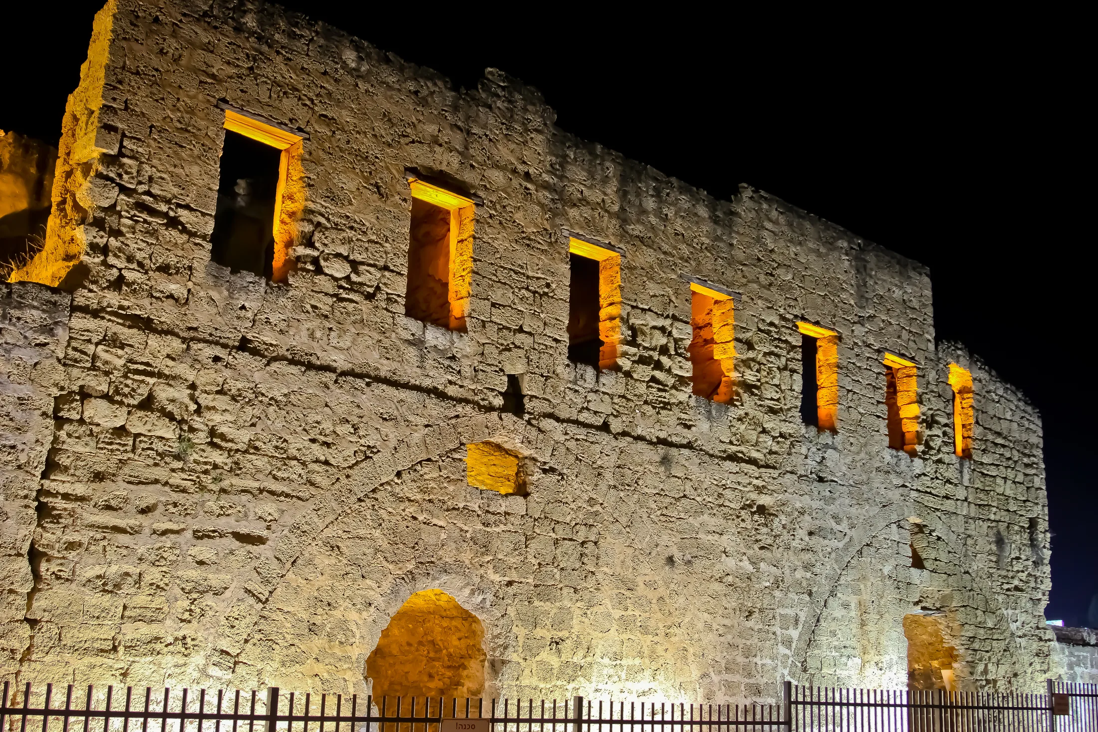 Illuminated historic stone facade