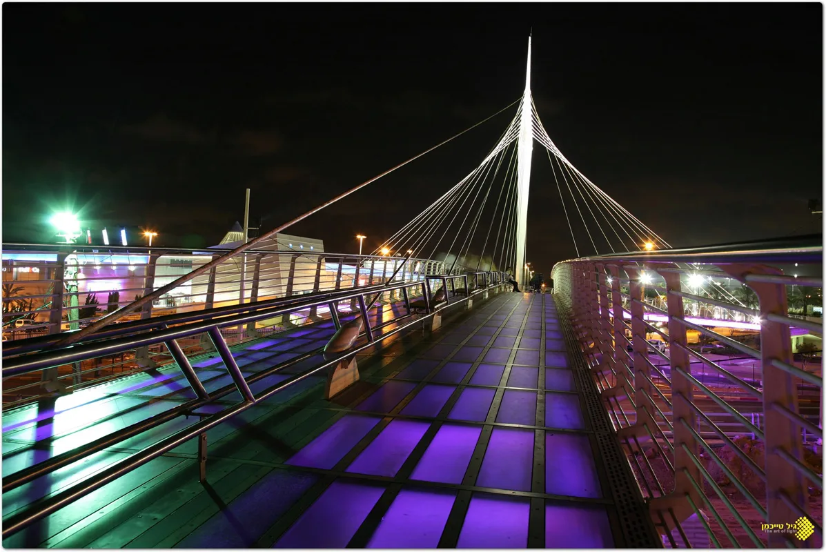 The deck with purple glowing pavers beneath the cable fan
