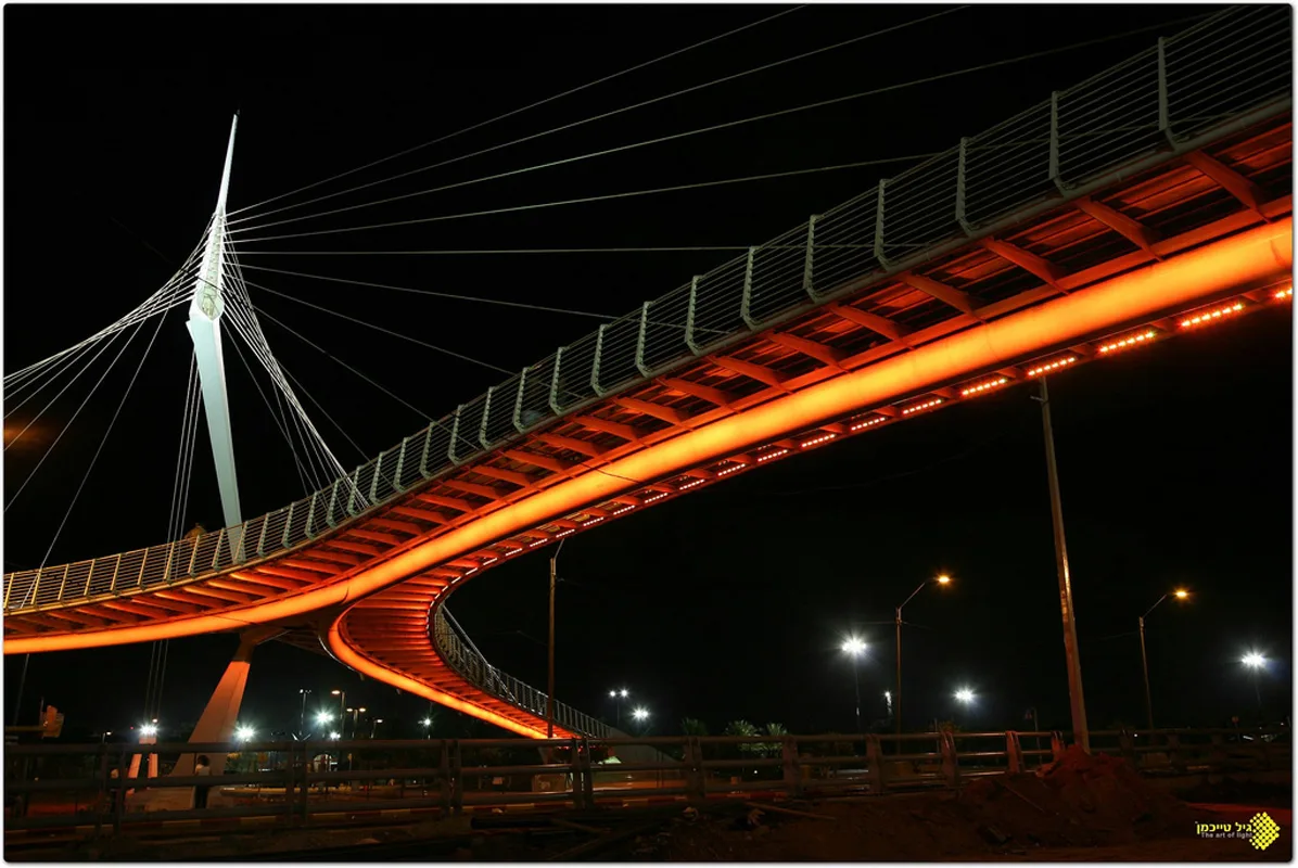The orange-lit soffit sweeping over the junction