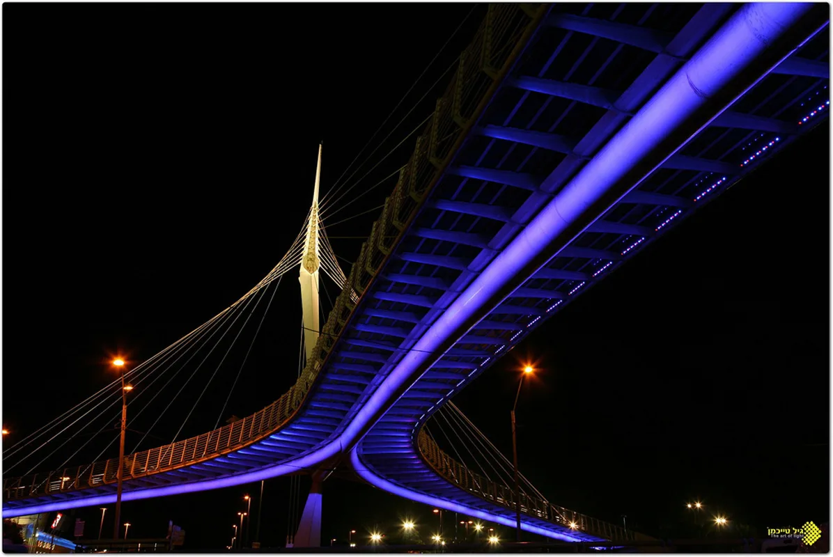 The deep-blue-lit underside and the white mast