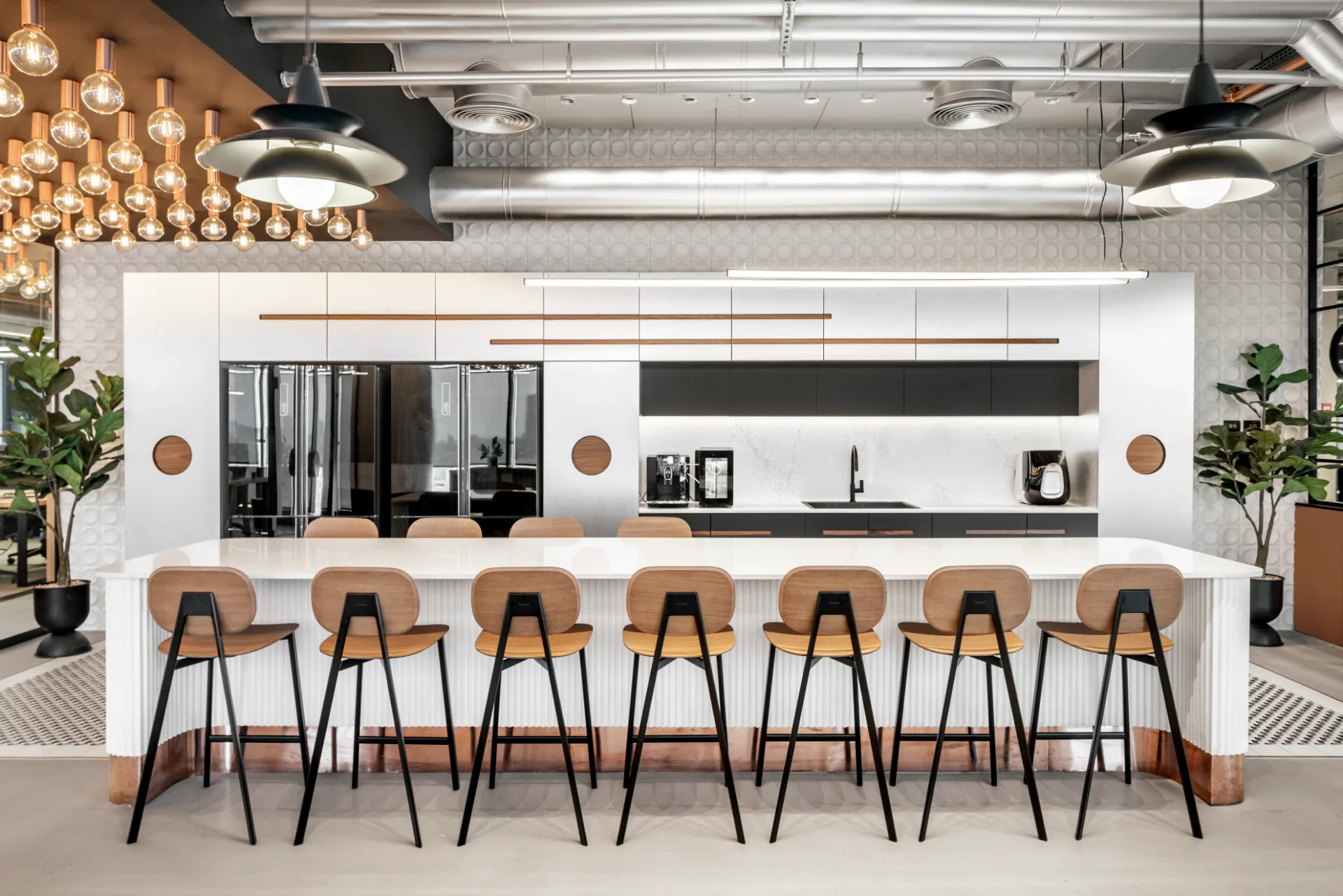 Kitchen bar with high stools and decorative lighting