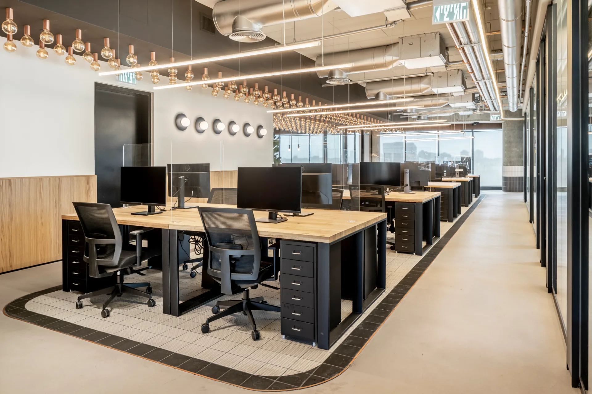 Open workspace with linear lighting