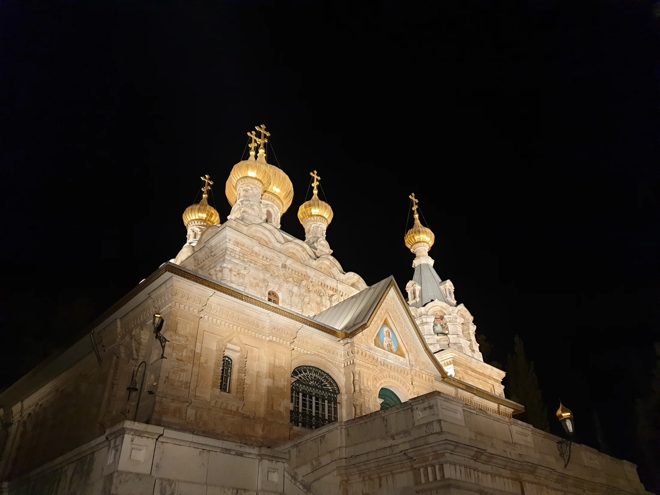 Illuminated stone facade of the church