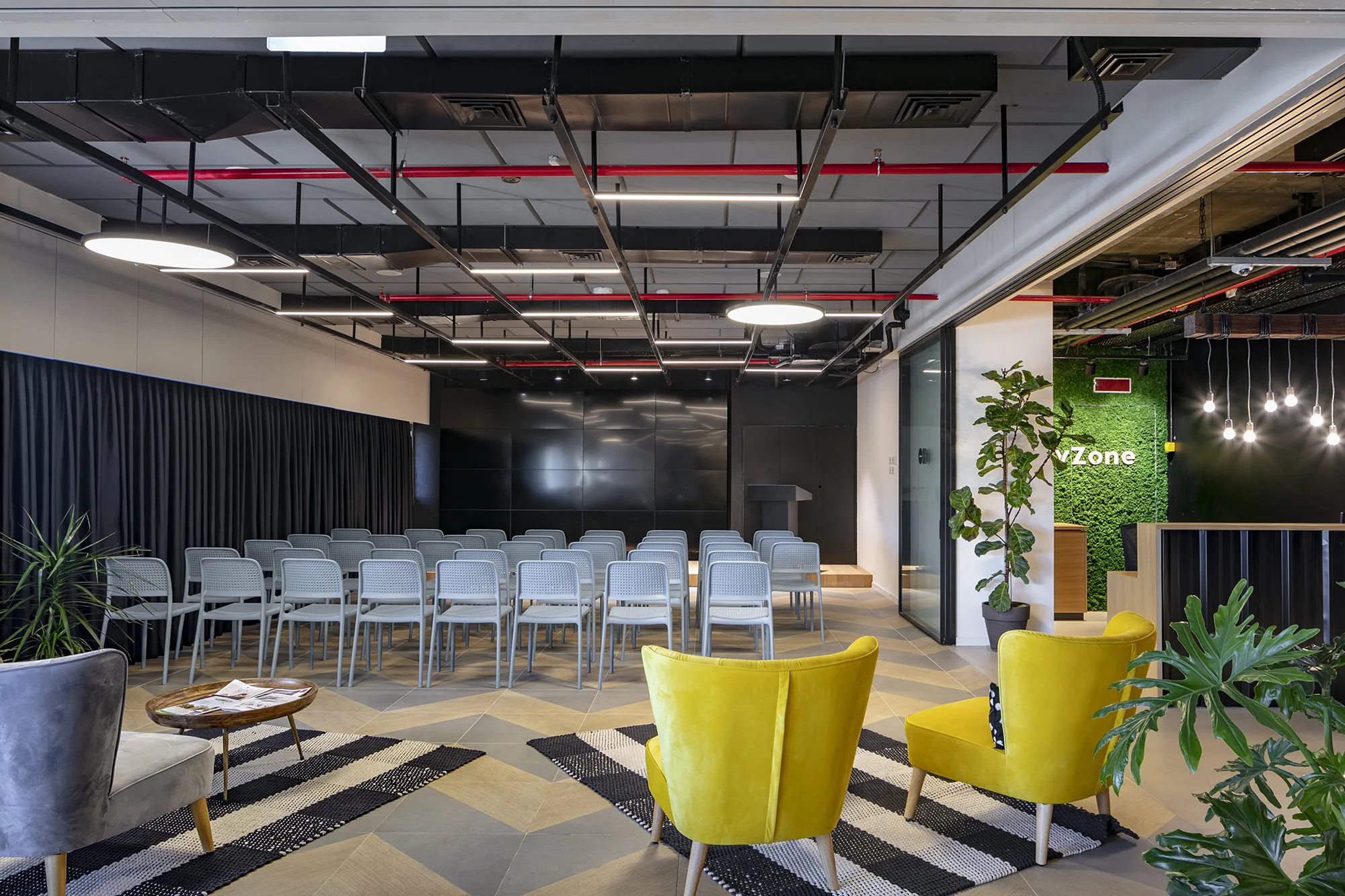 The event space with lounge seating and a moss CityZone logo