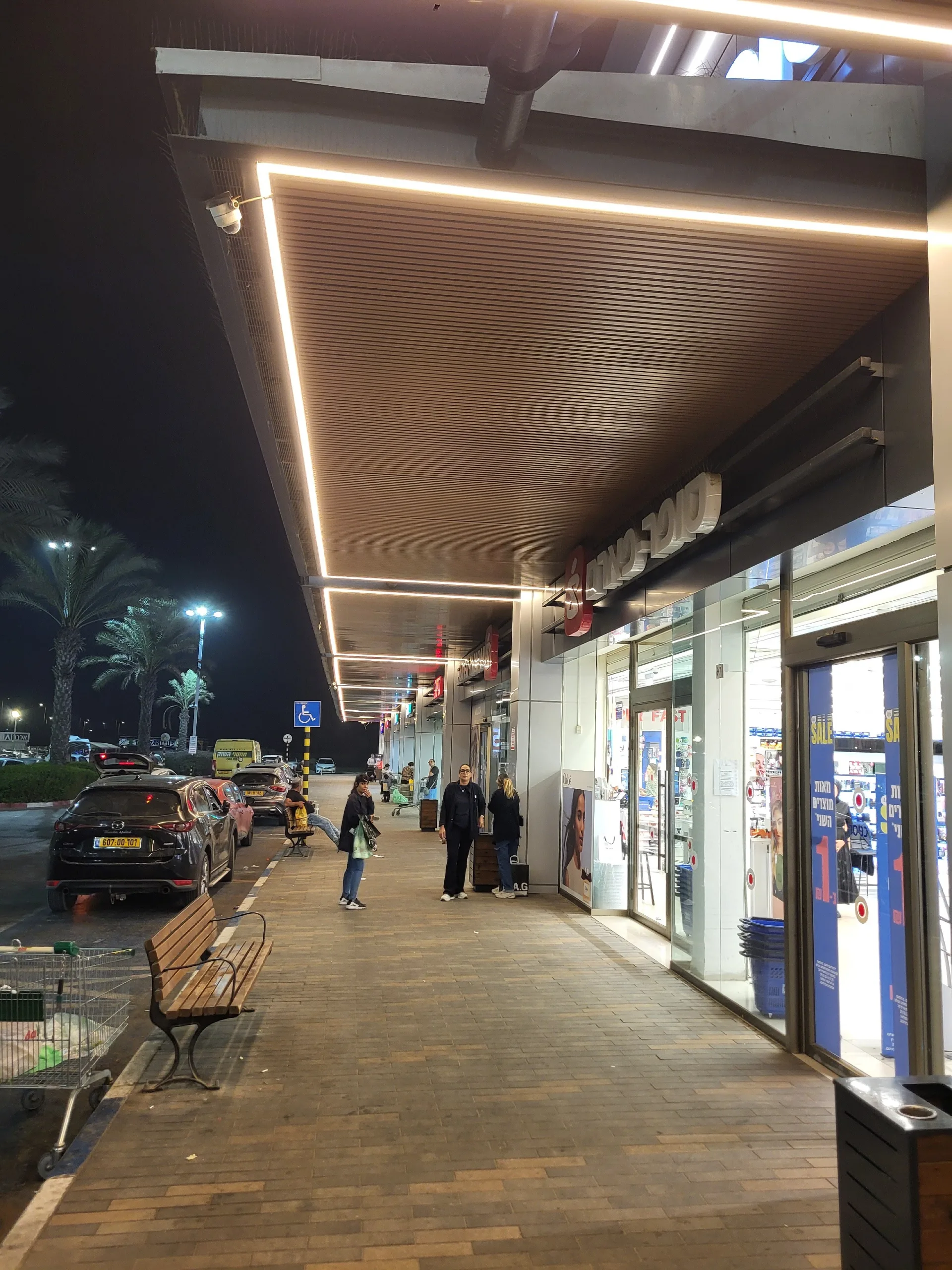 Covered walkway with warm linear ceiling light