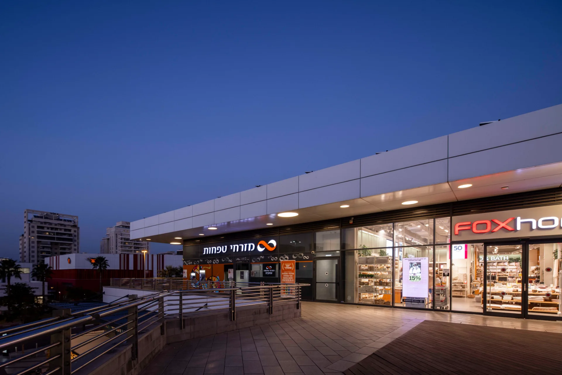 Retail frontage under an illuminated canopy