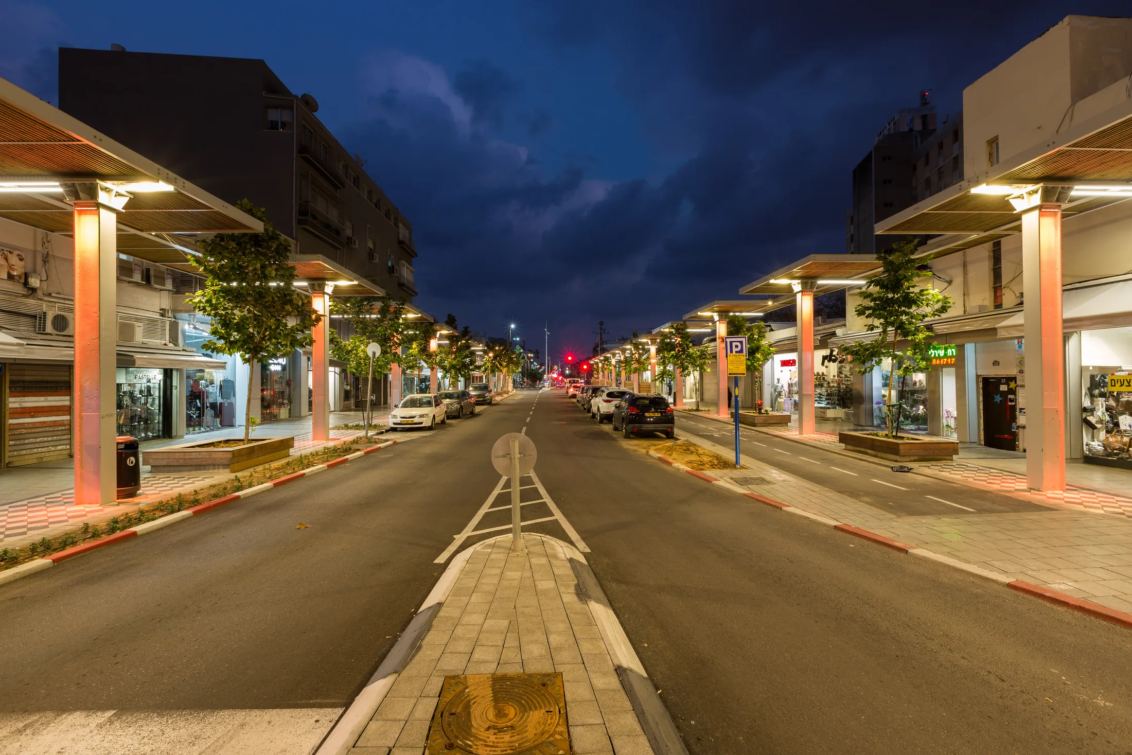 The street at night with accent lighting on the facades