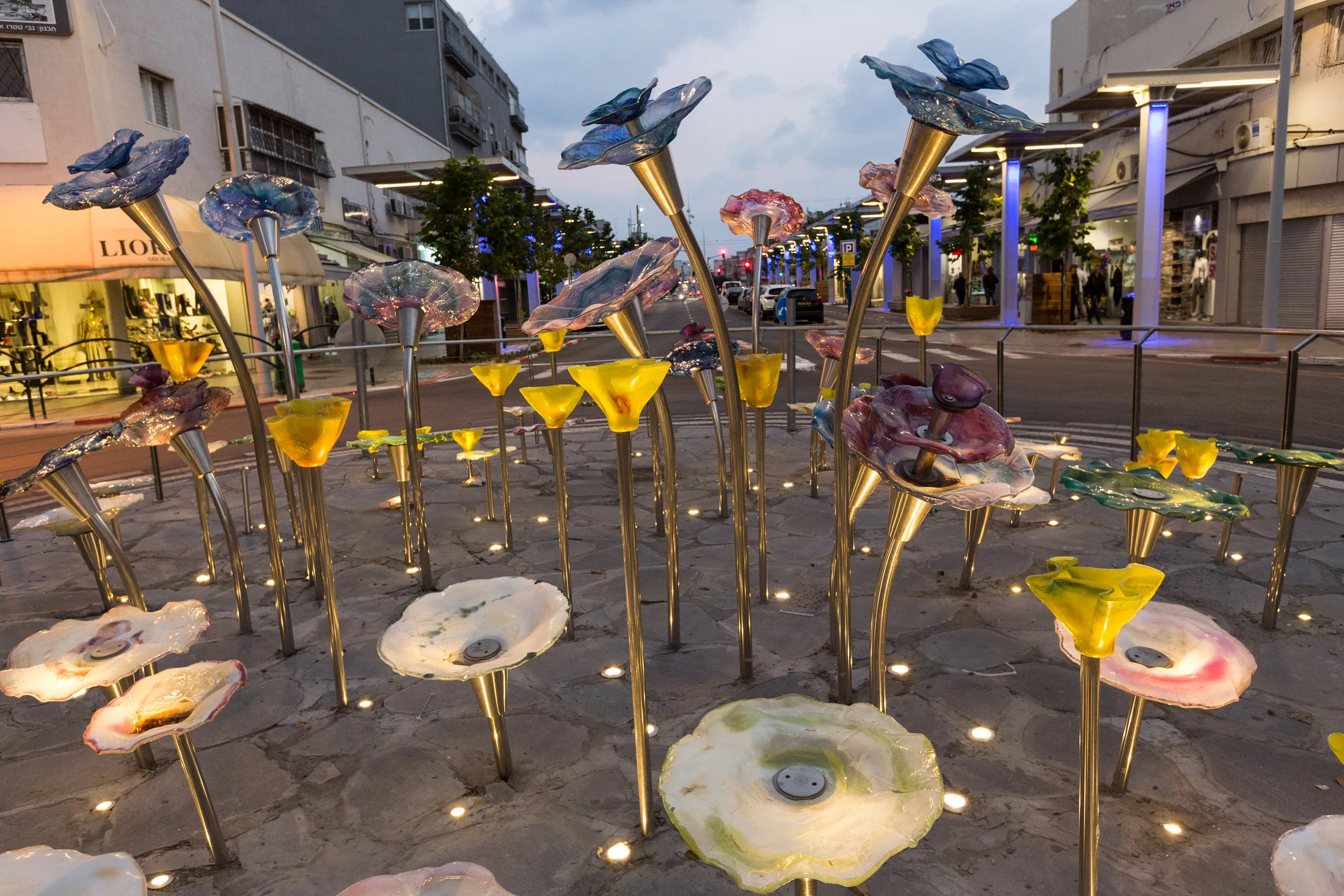 A close view of the flower-shaped sculptural light fixtures