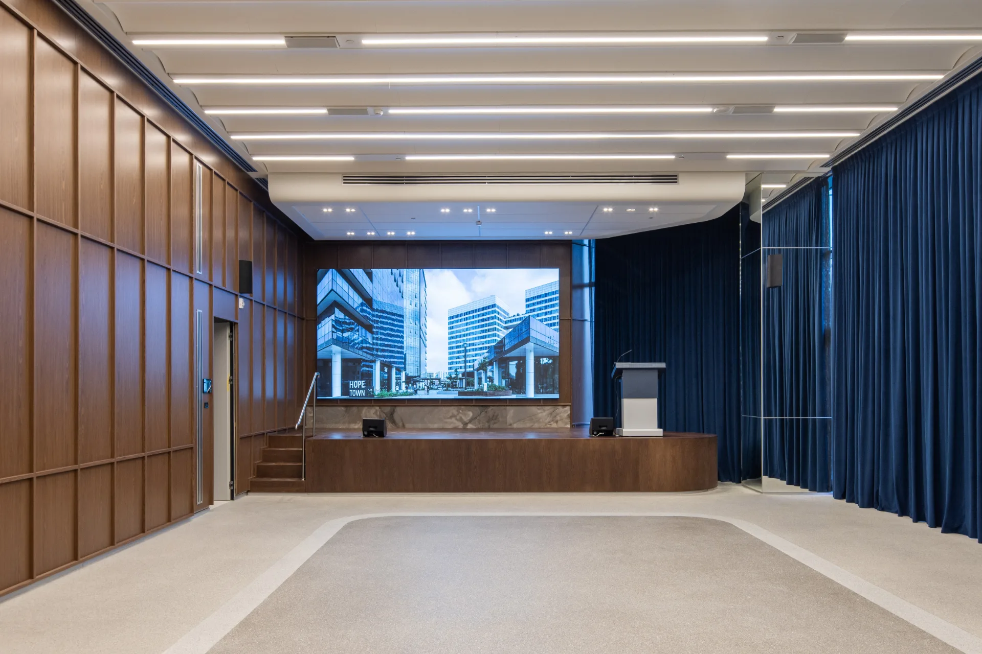 Reception lobby with an exposed ceiling and full-height glazing