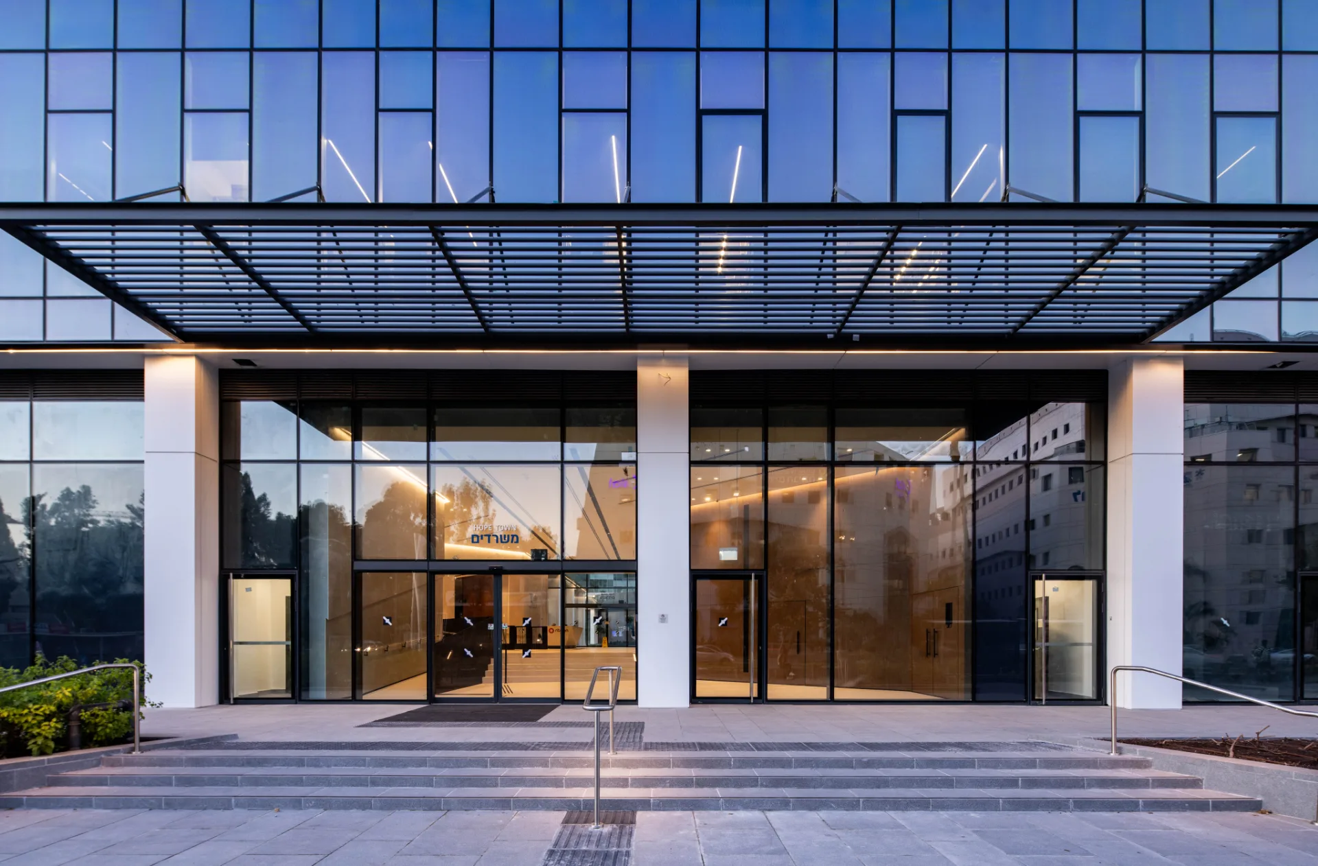 Illuminated glazed entrance lobby at night