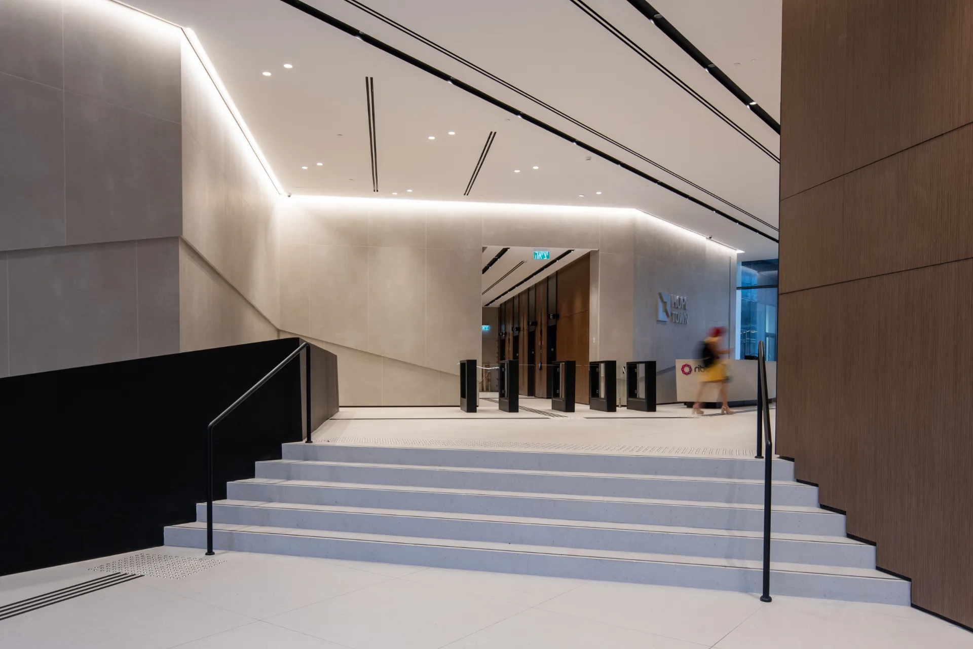 Grand stair and lobby under linear lighting