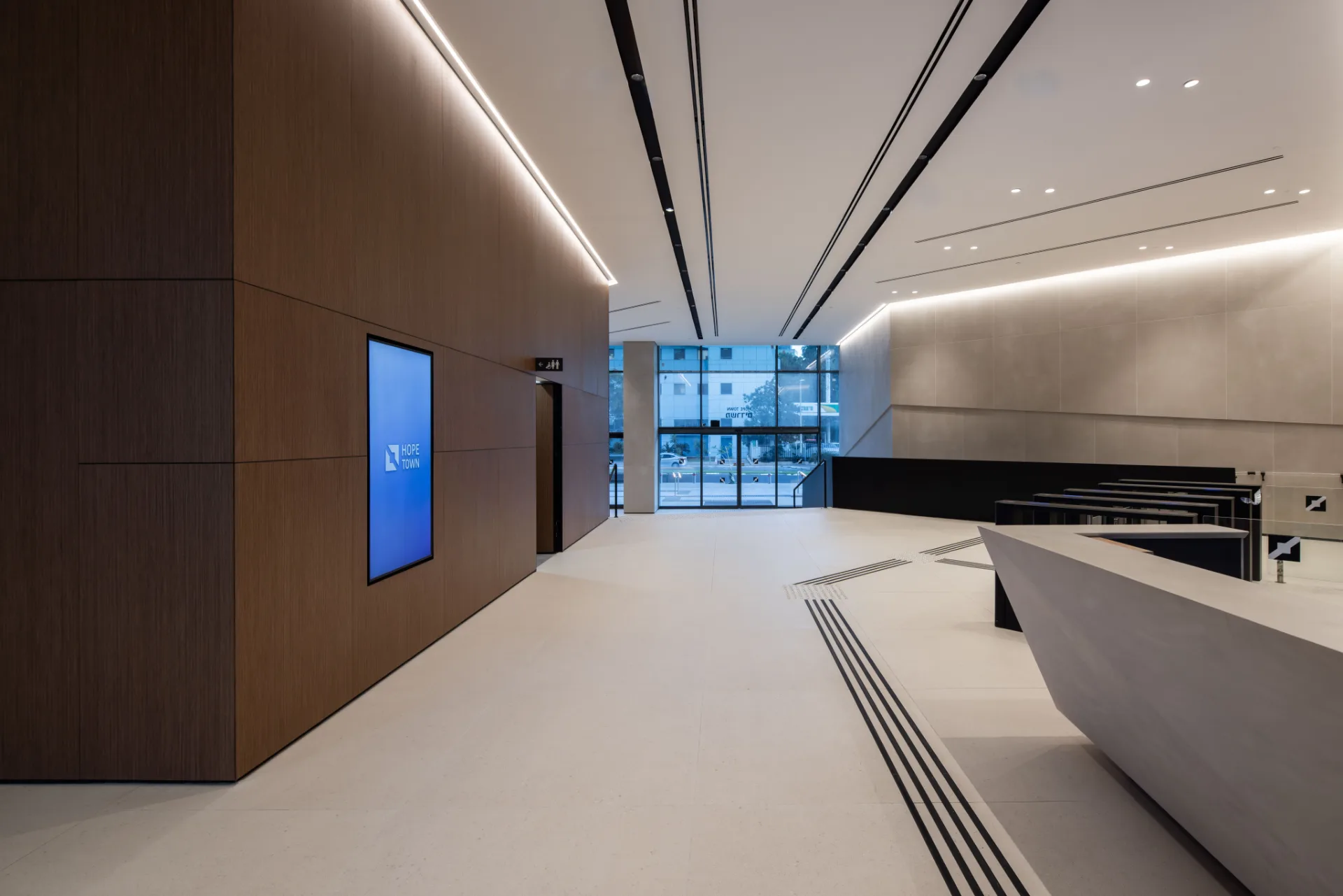 Angular lobby corridor with linear cove lighting