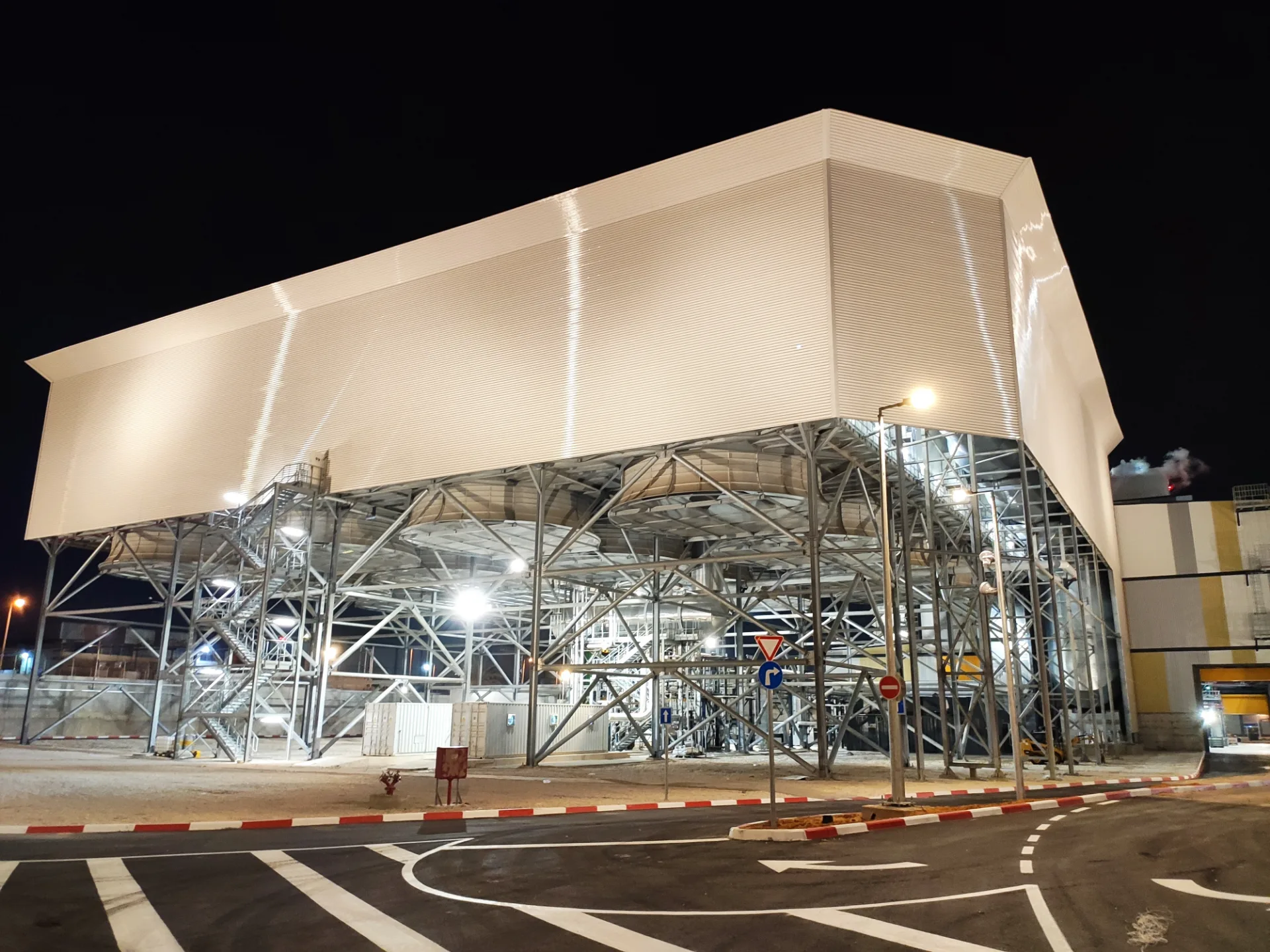 Illuminated turbine hall raised on a steel structure