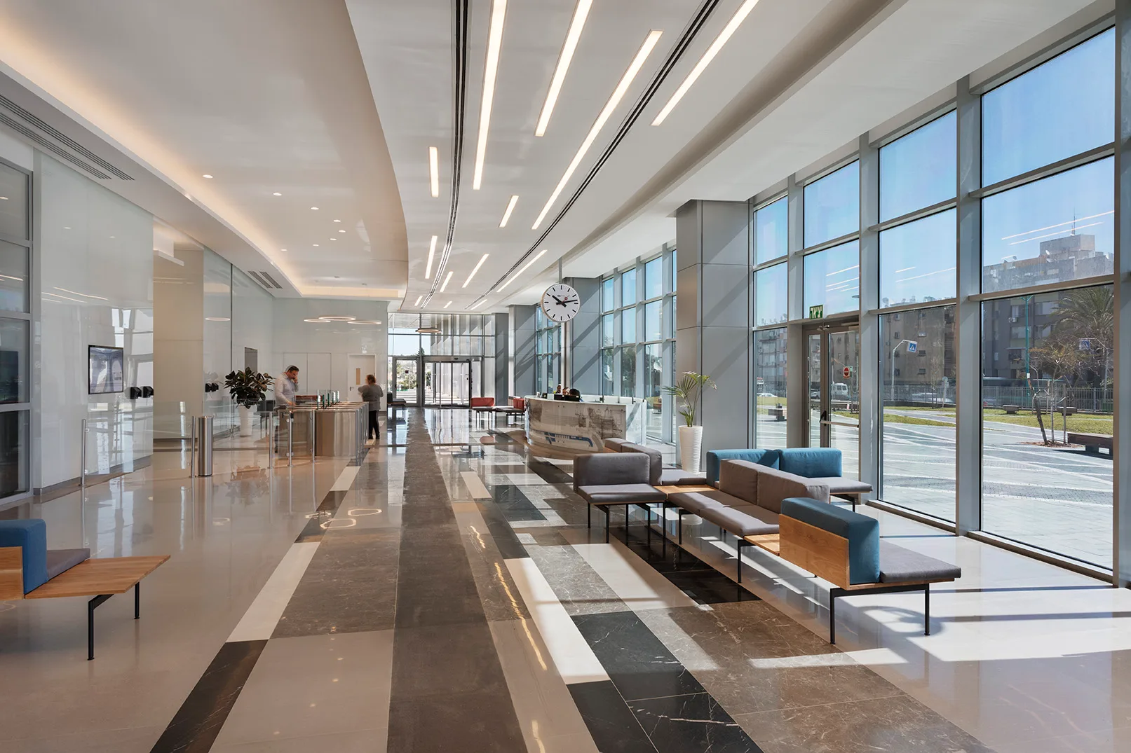 Illuminated entrance lobby with linear ceiling lighting