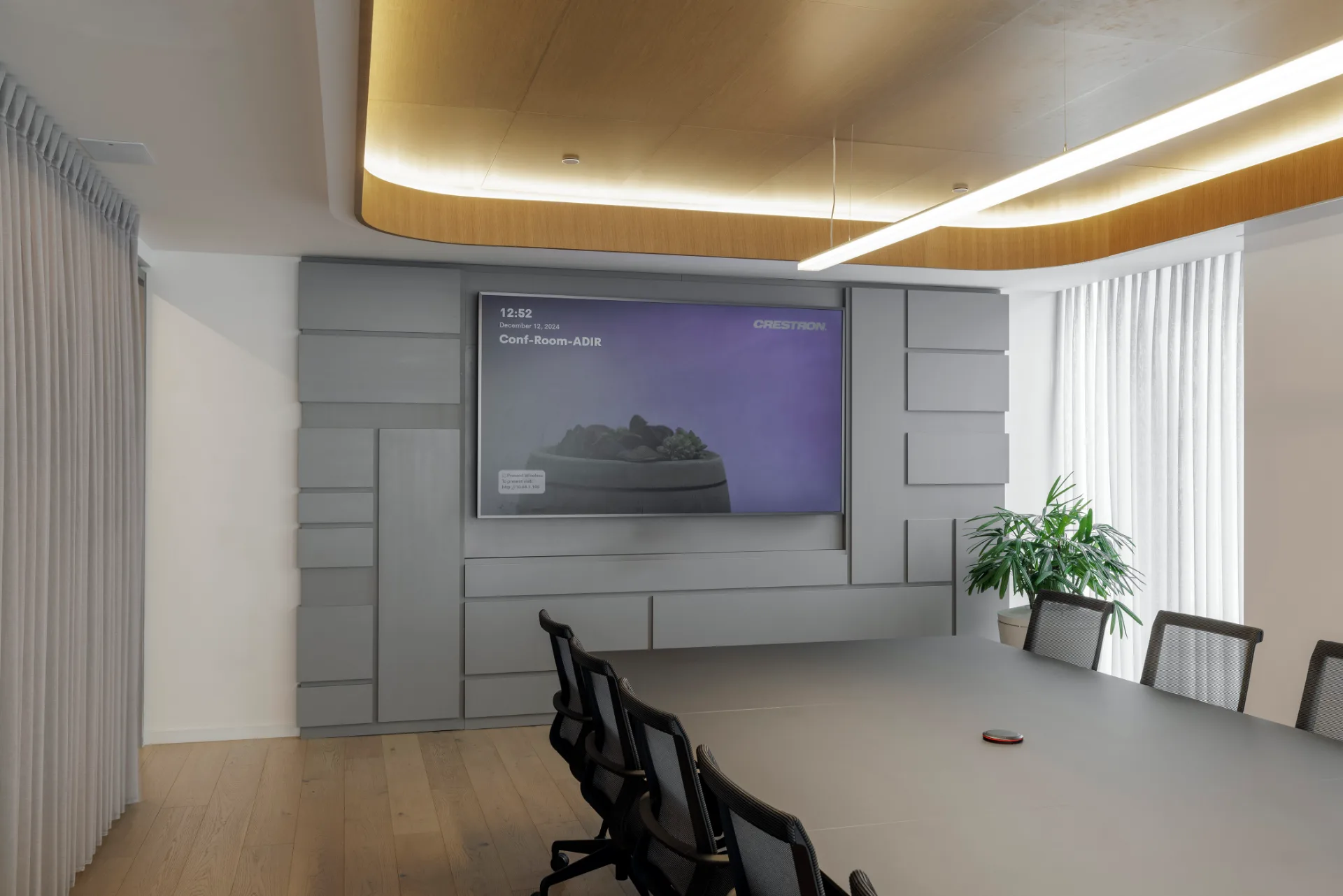 Circulation corridor along glass-partitioned offices