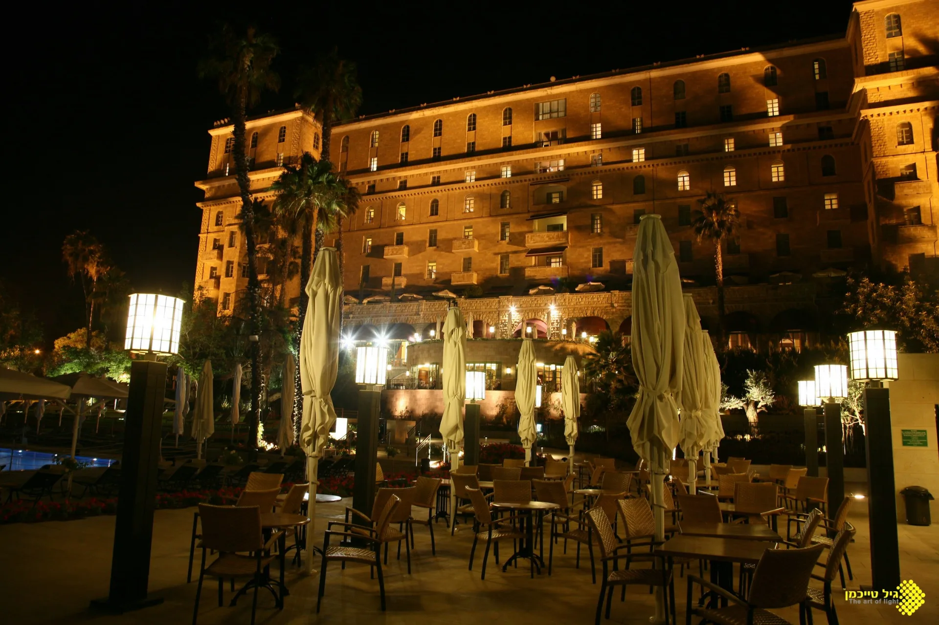 Illuminated pink-limestone facade at night