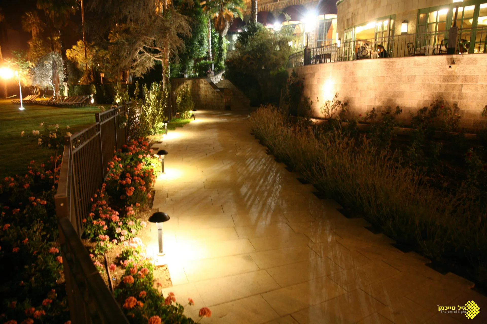 Illuminated garden path with low bollards