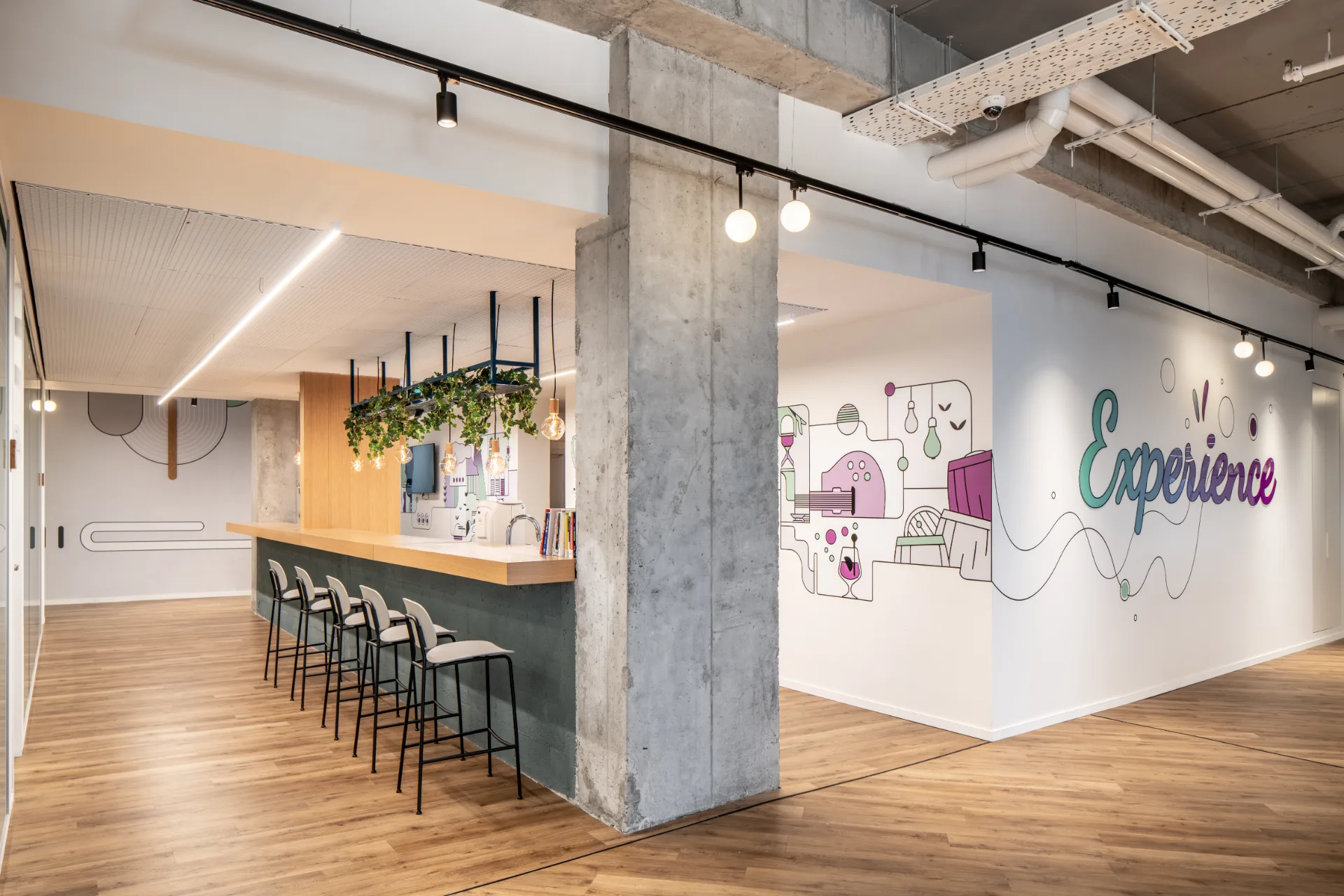 High seating bar beside an illustrated wall