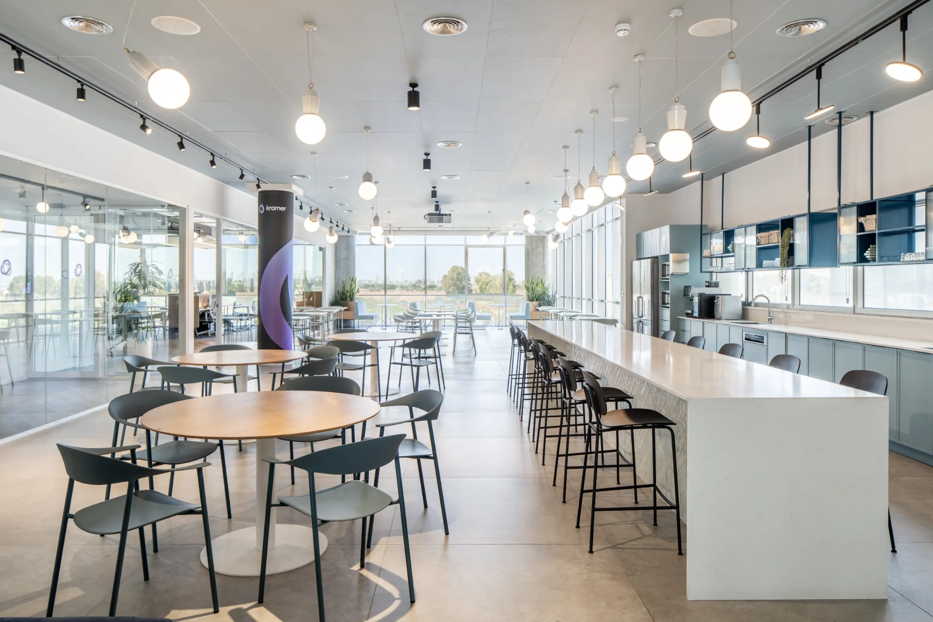 Bright cafeteria with a central island and seating