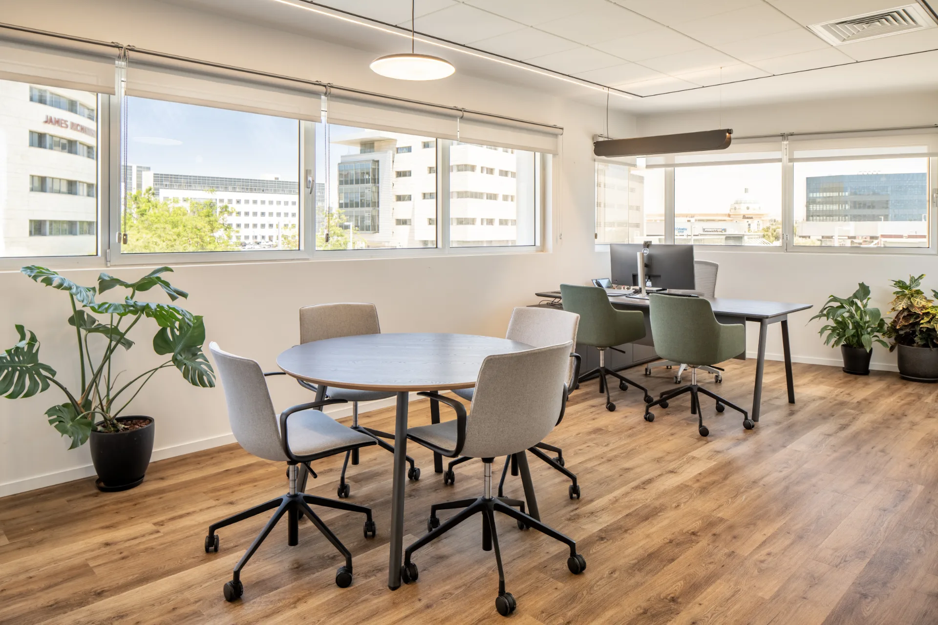 Team room with a round table and planting