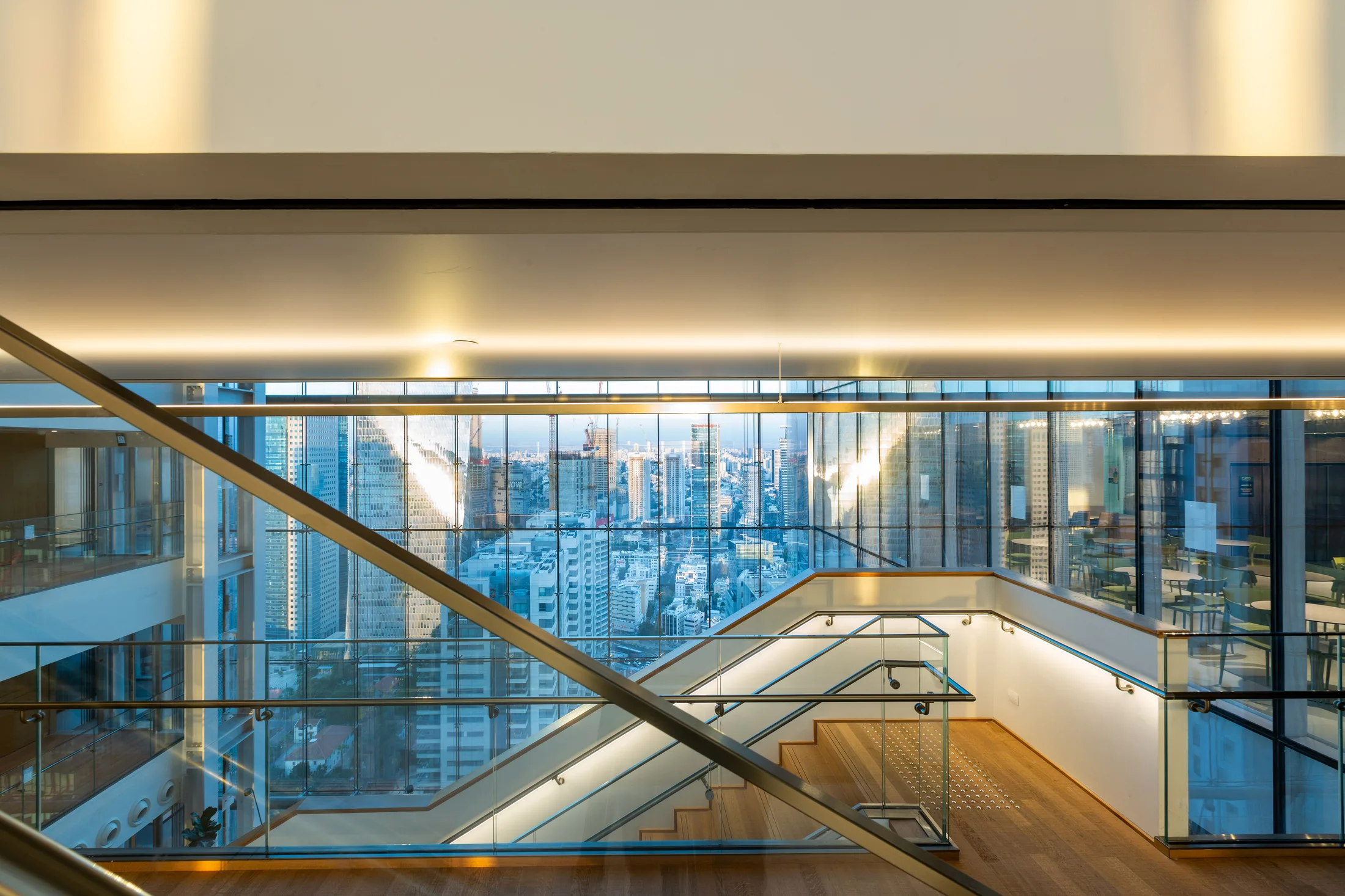 Glass stairs and a bridge in the atrium