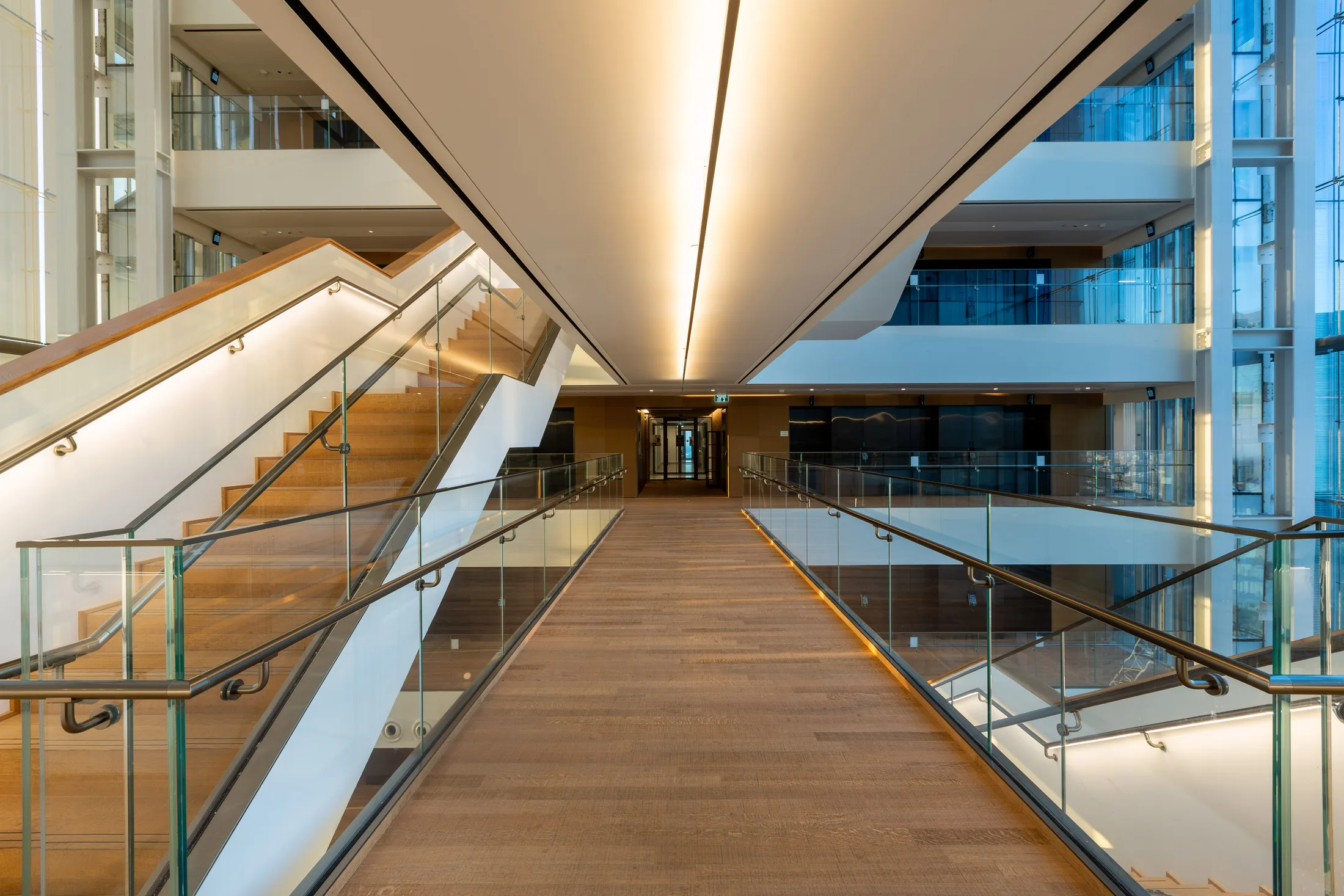 An upward view of the wood soffit and the diamond facade