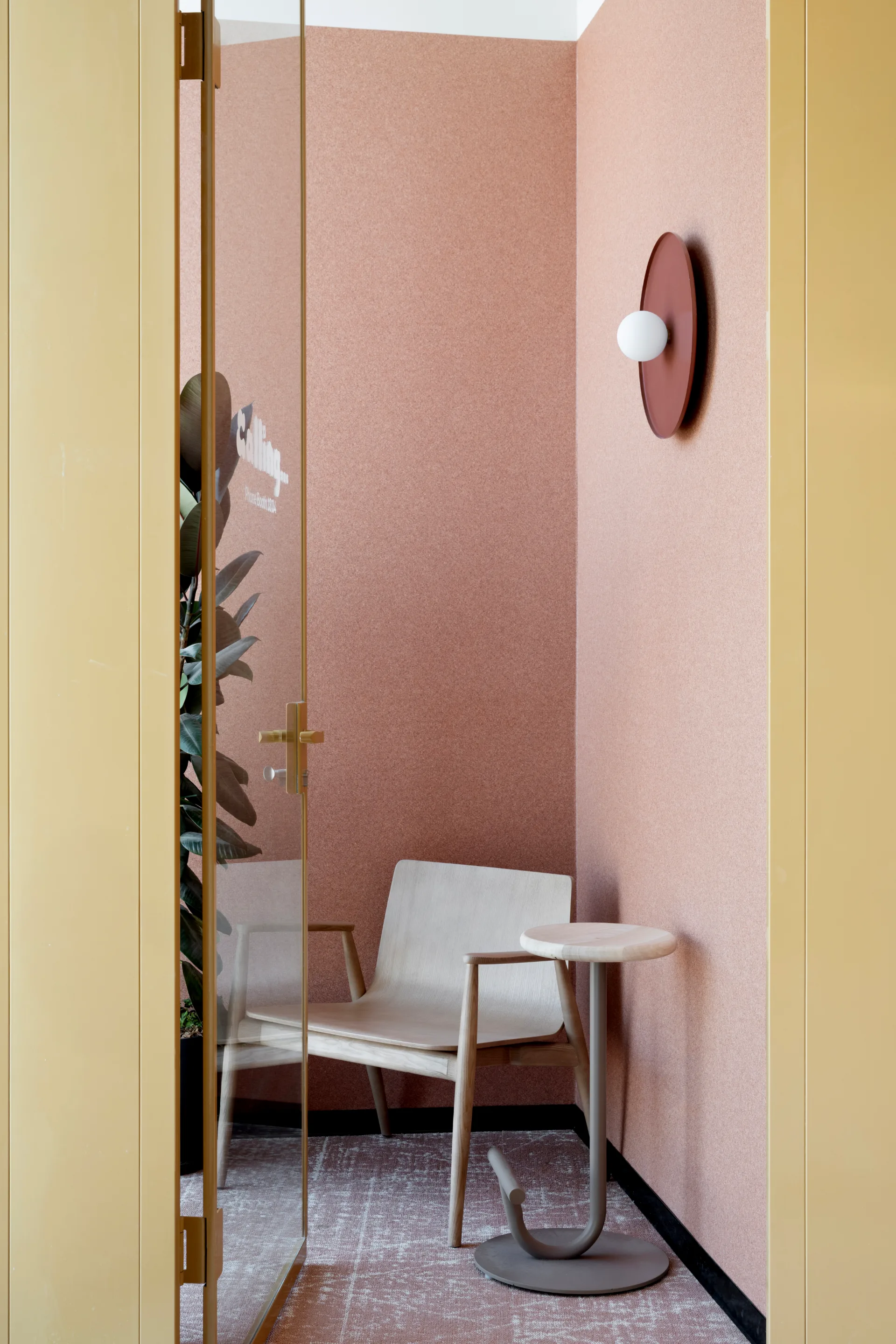 A pink focus nook with a disc wall light