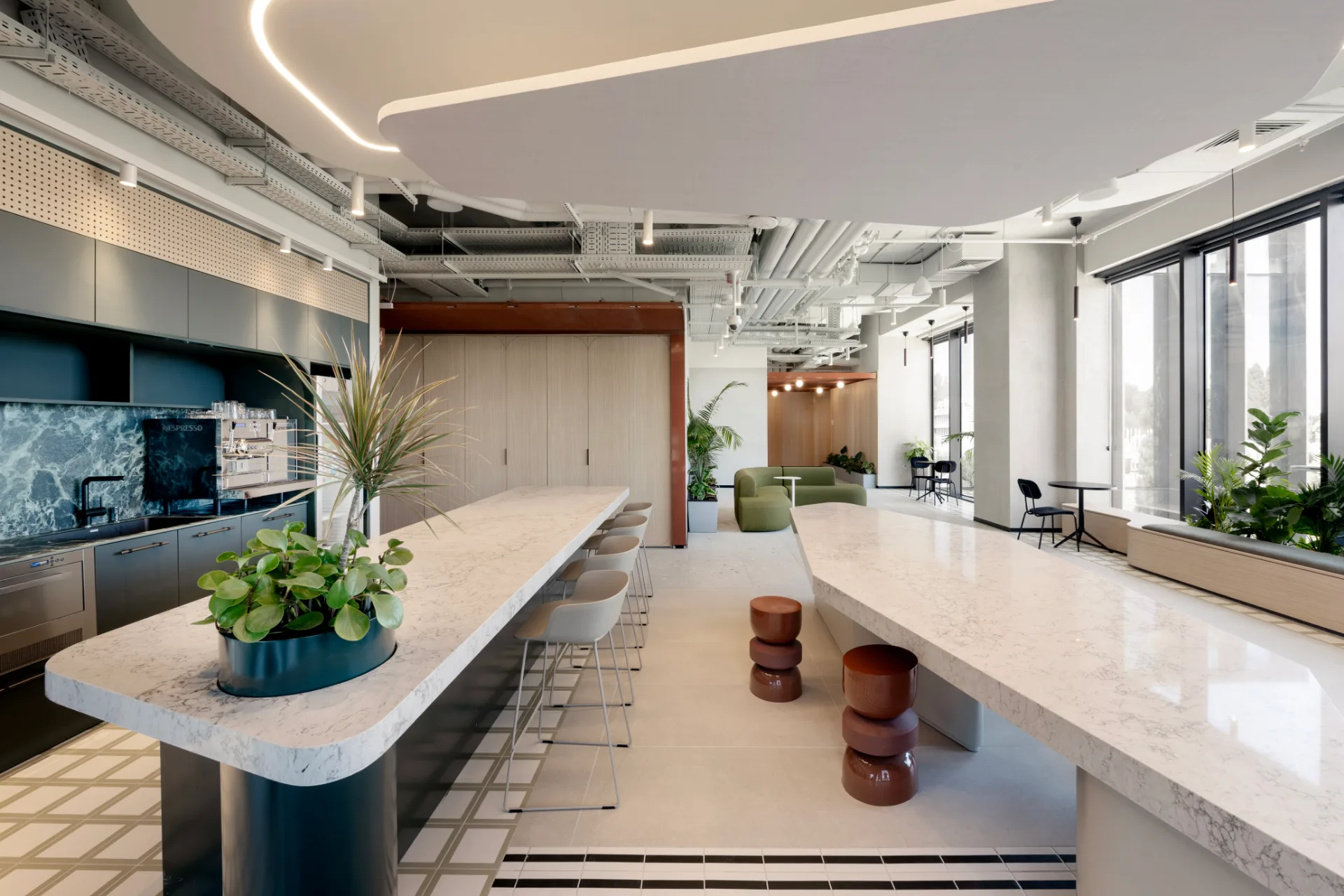 Pantry and bar beneath a luminous curved ceiling