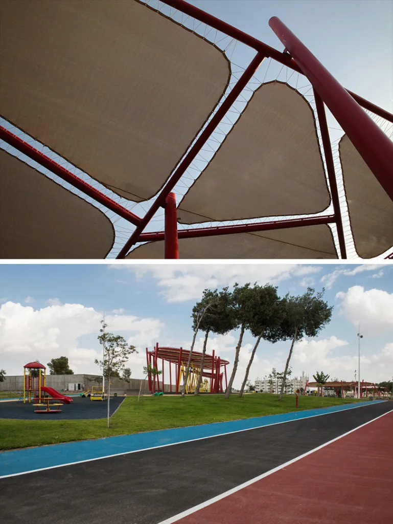 The red shade pavilion, playground, and colored tracks at Marmalade Park
