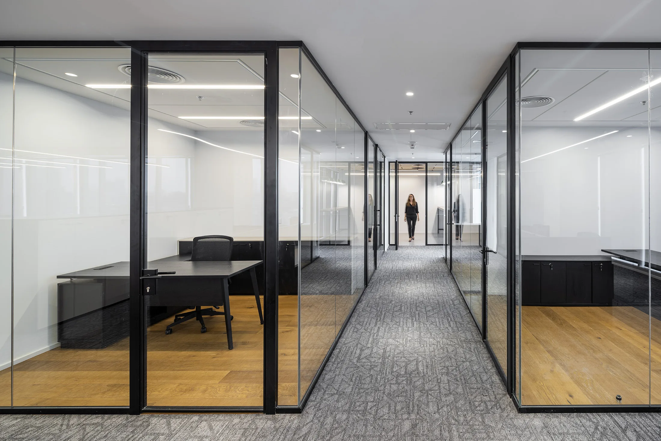 Glazed office fronts along the corridor