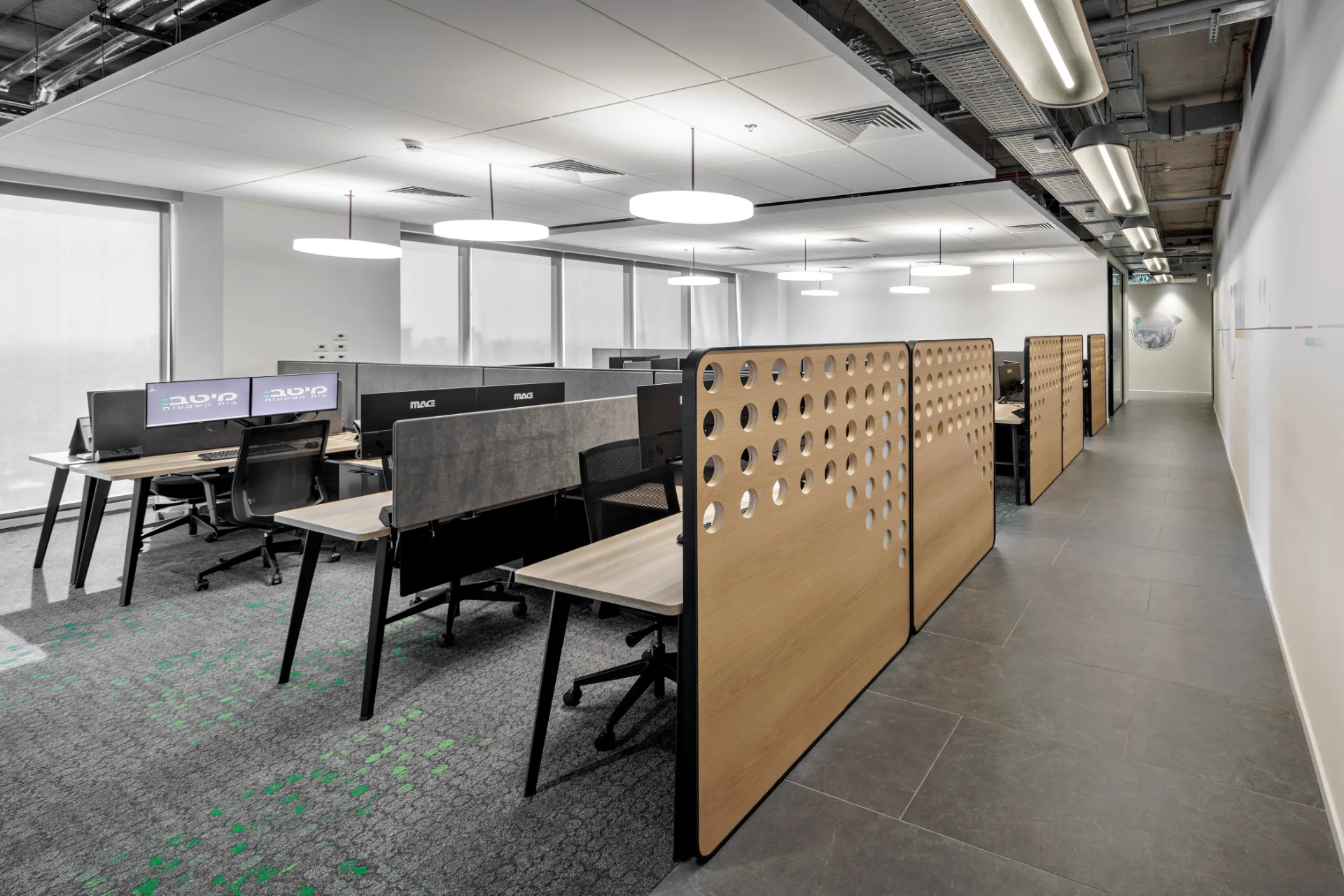 Open workspace beside glazed offices