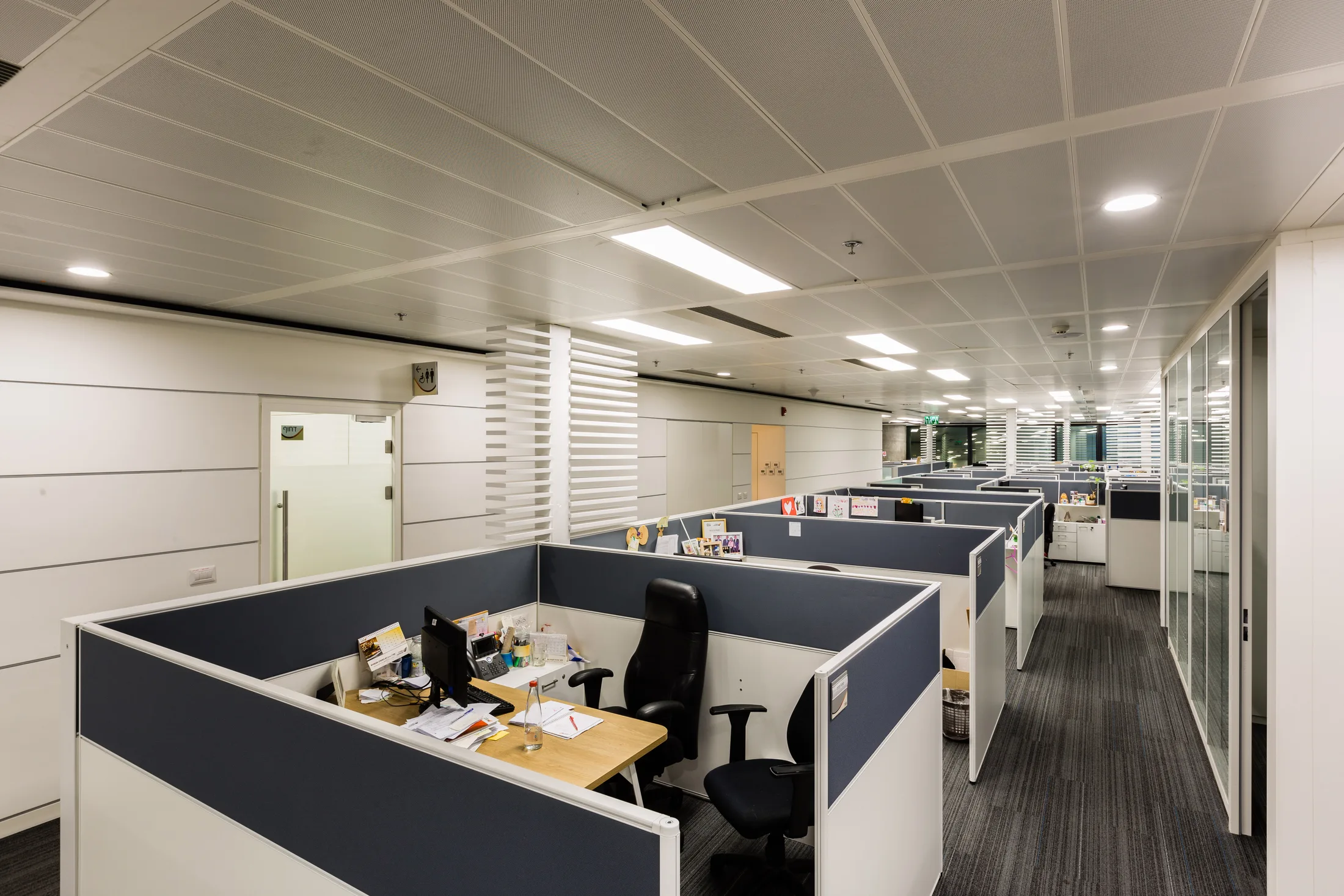 Workstations and glass-walled offices on a typical floor