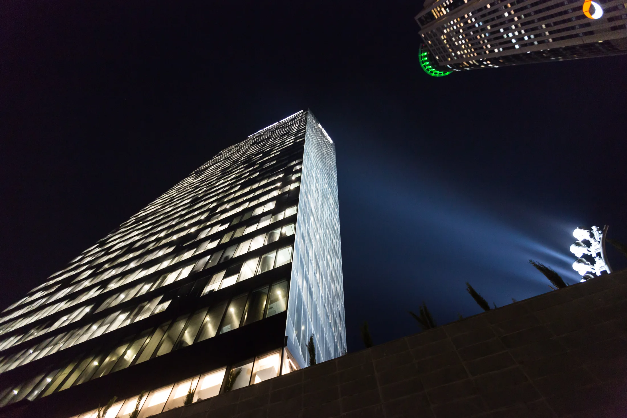 The lit tower crown against the night sky