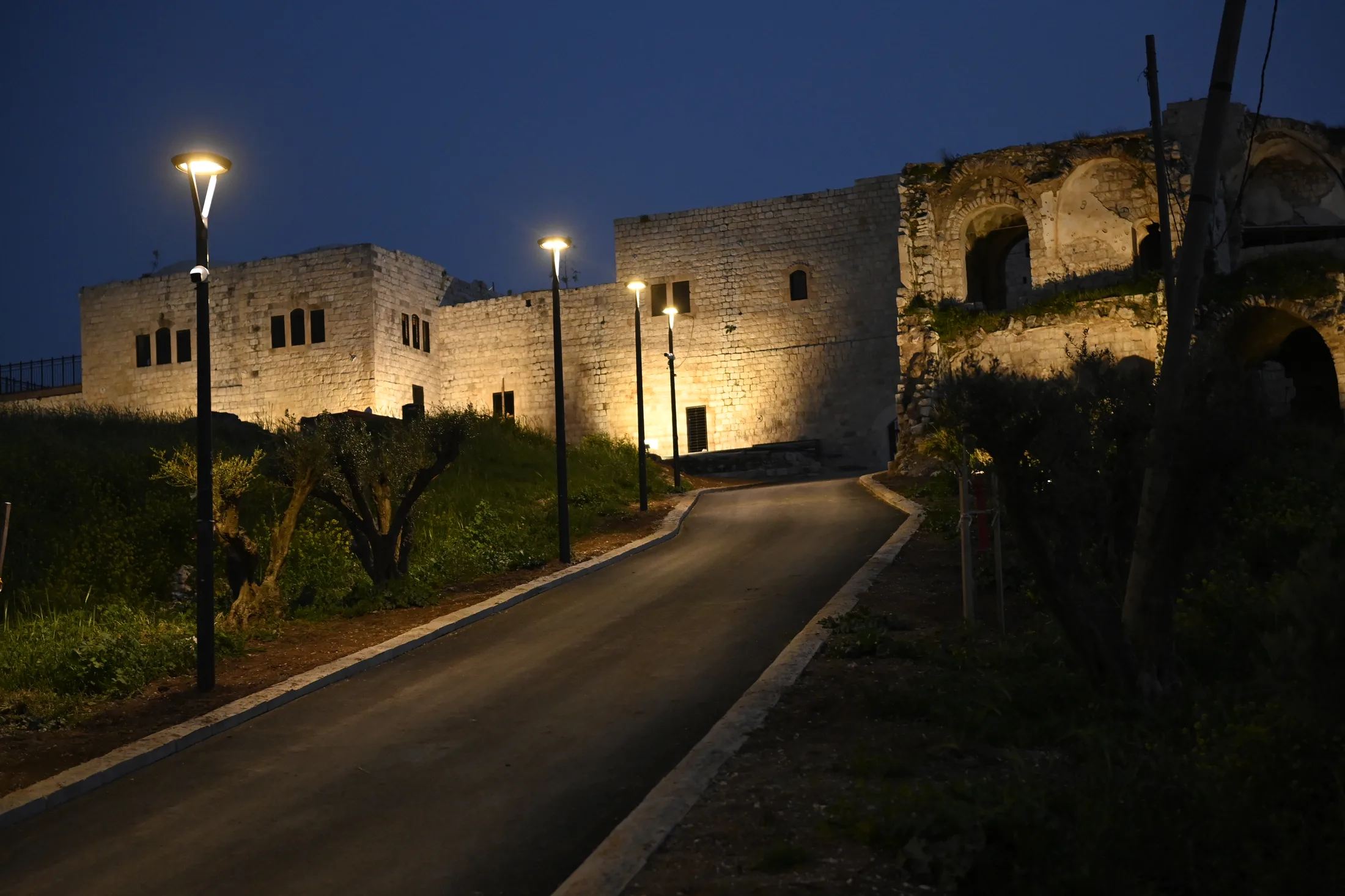 Illuminated path at Migdal Tzedek National Park