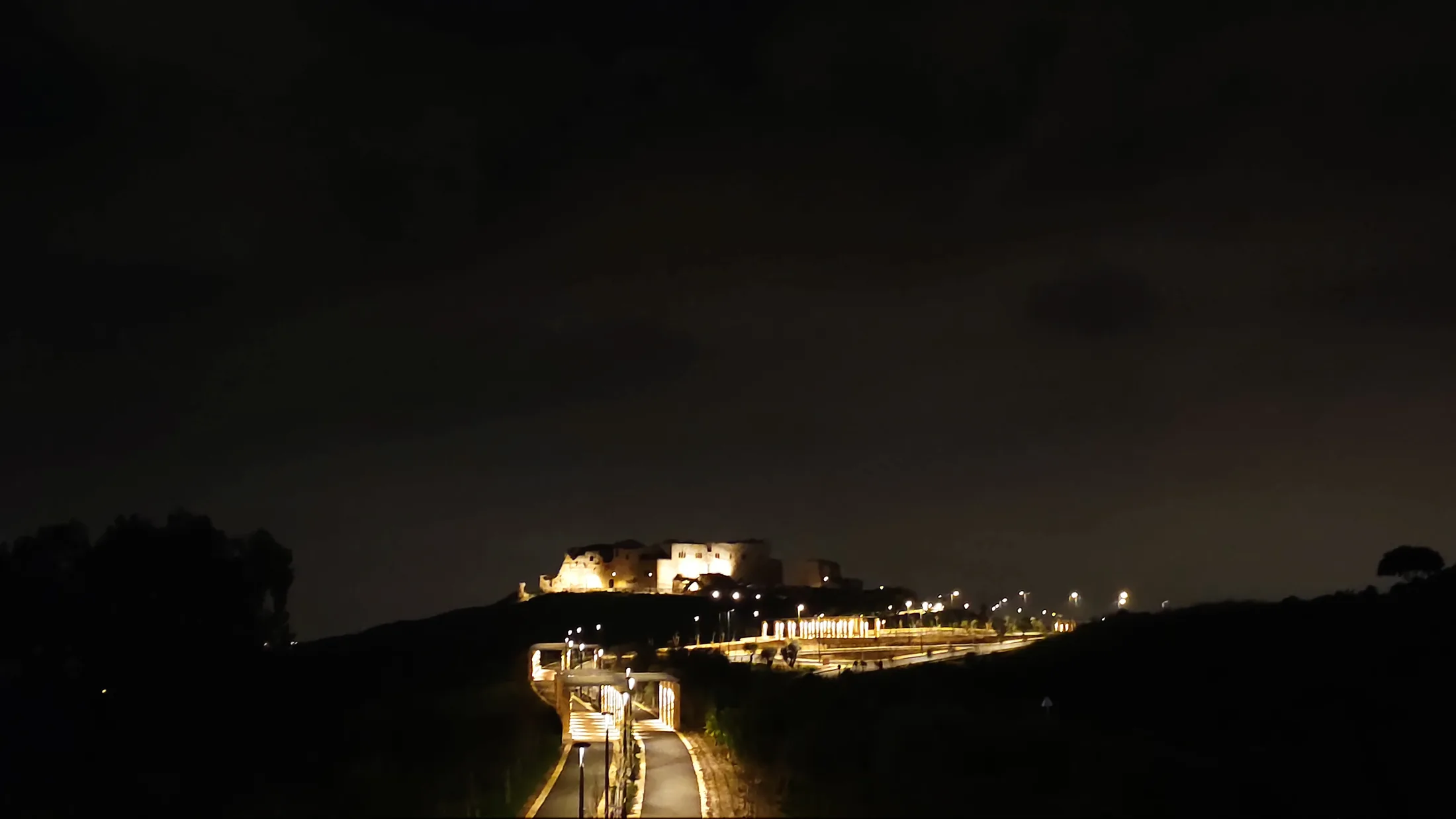 Illuminated historic structure at Migdal Tzedek