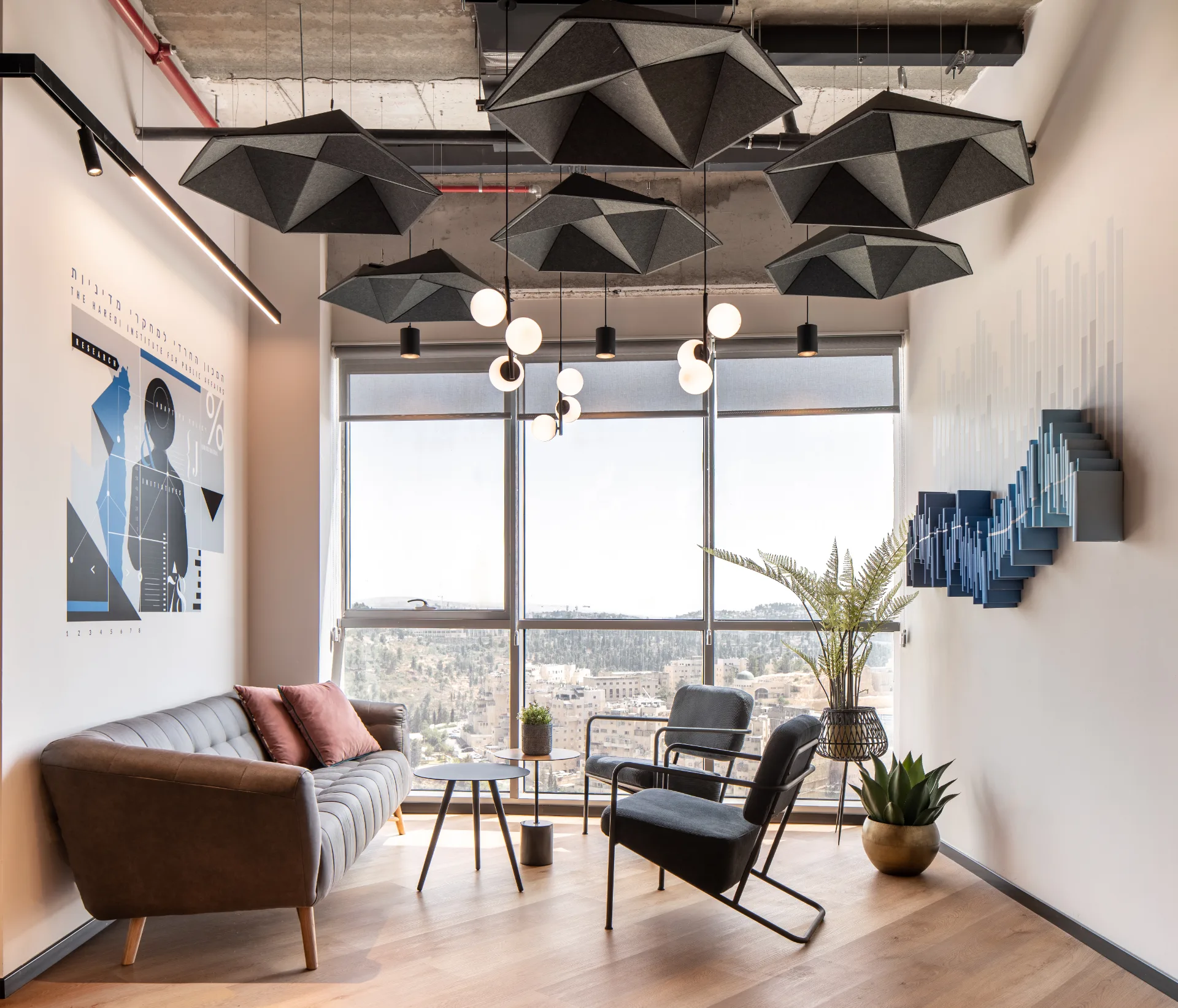 Waiting lounge with a sculptural pendant and Jerusalem views