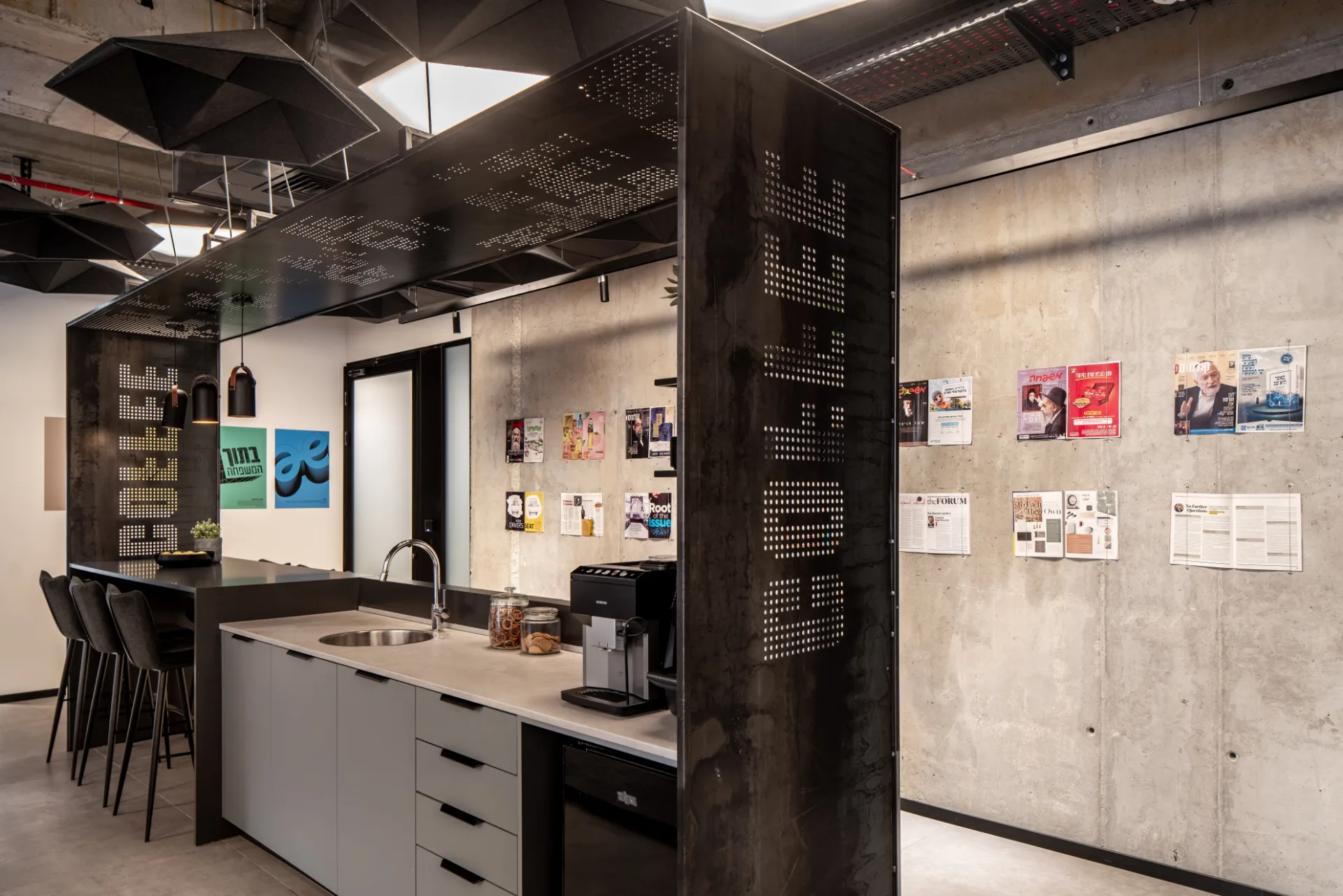 Kitchenette with a wall of magazine covers