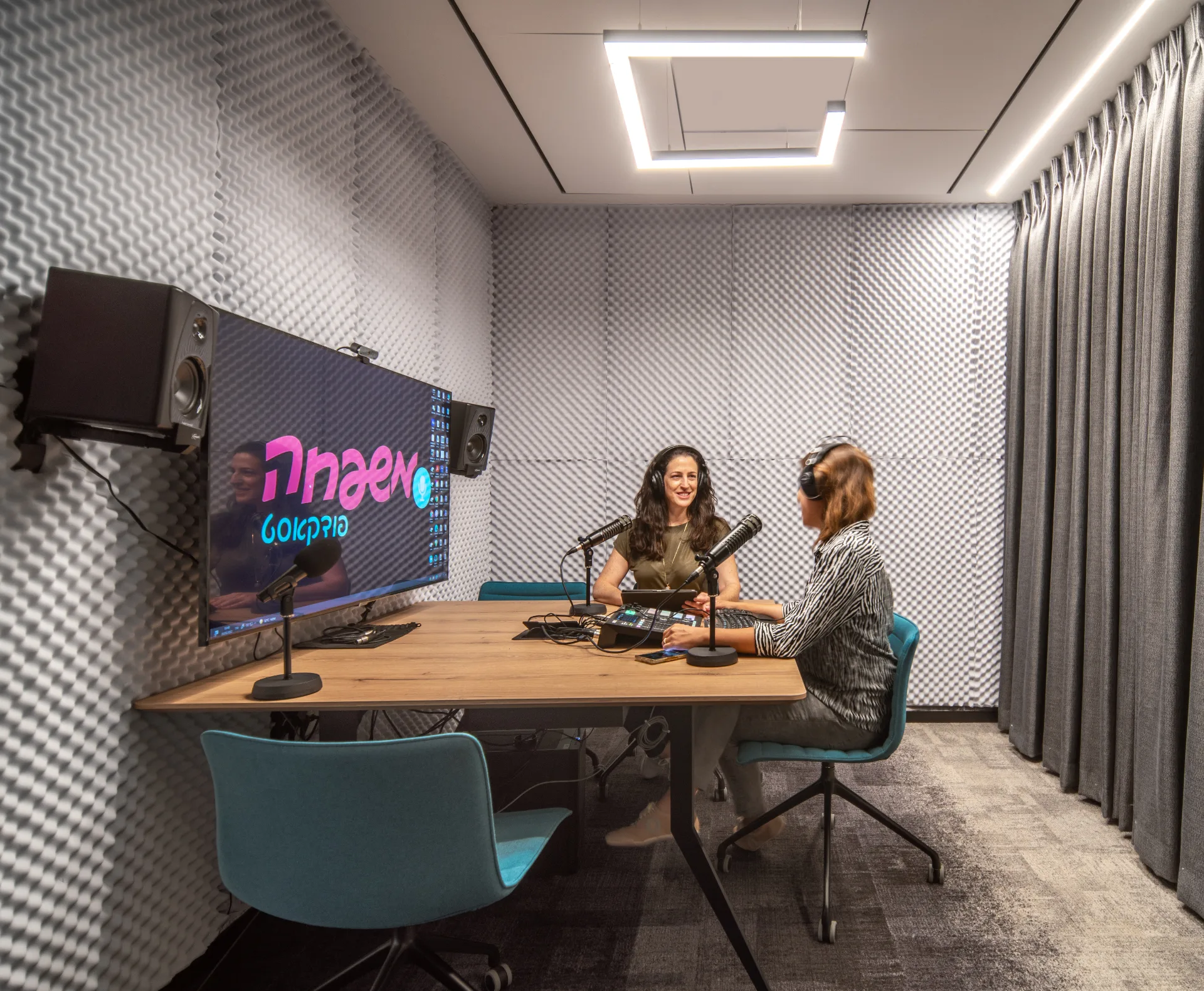 Recording studio with a neon sign